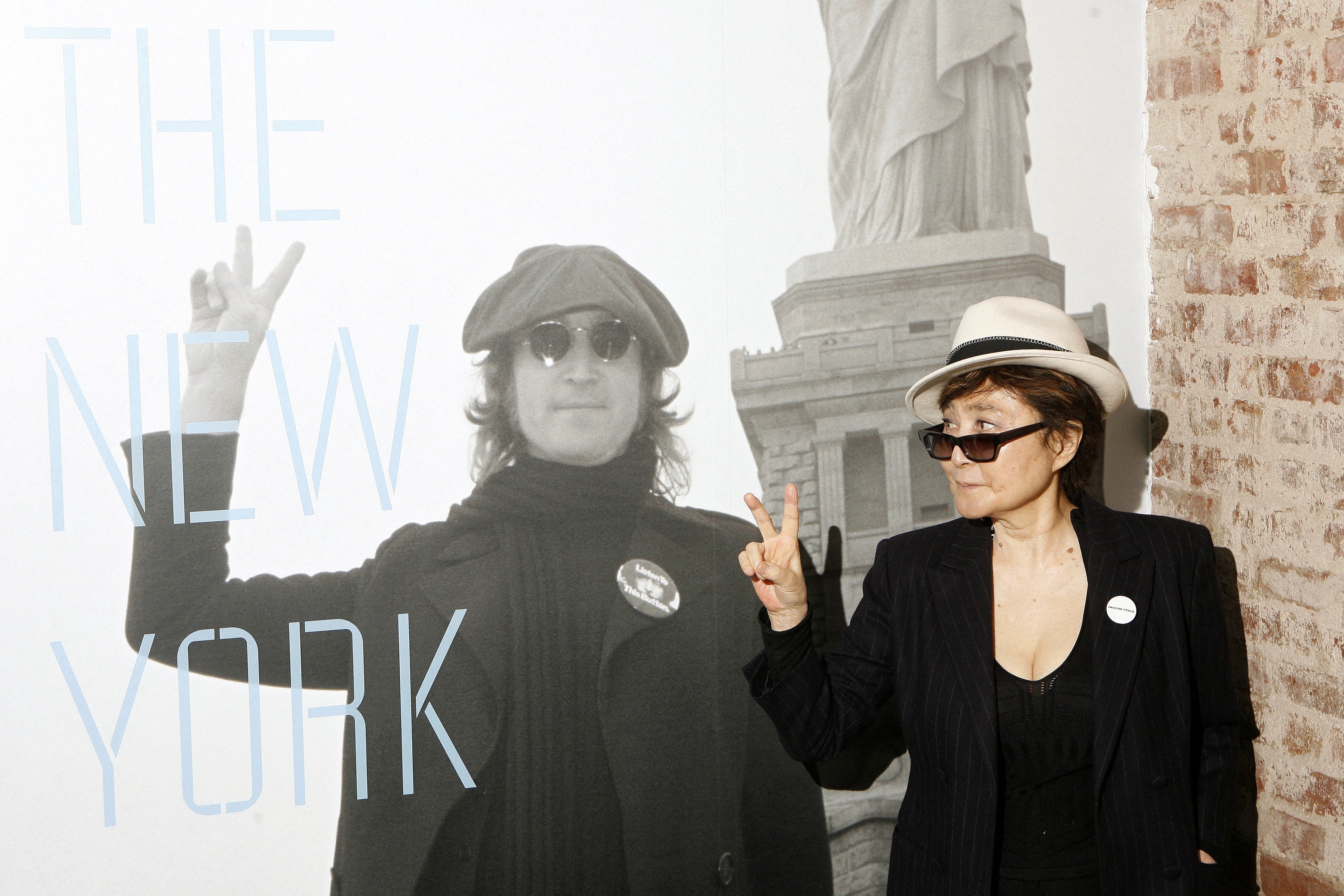 oko Ono gestures as she unveils the 'John Lennon: The New York City Years’ exhibit at the Rock & Roll Hall of Fame Annex in New York May 11, 2009