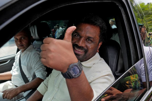 <p>Sri Lanka’s president and National People’s Power (NPP) party leader Anura Kumara Dissanayake gestures as he leaves after casting his vote</p>
