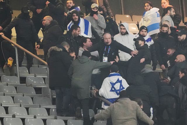 <p>Fans argue on stands during the UEFA Nations League soccer match between France and Israel at the Stade de France stadium in Saint-Denis</p>