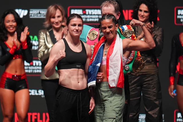 Katie Taylor, left, and Amanda Serranon pose during a weigh-in ahead of their undisputed super lightweight title bout (Julio Cortez/AP)