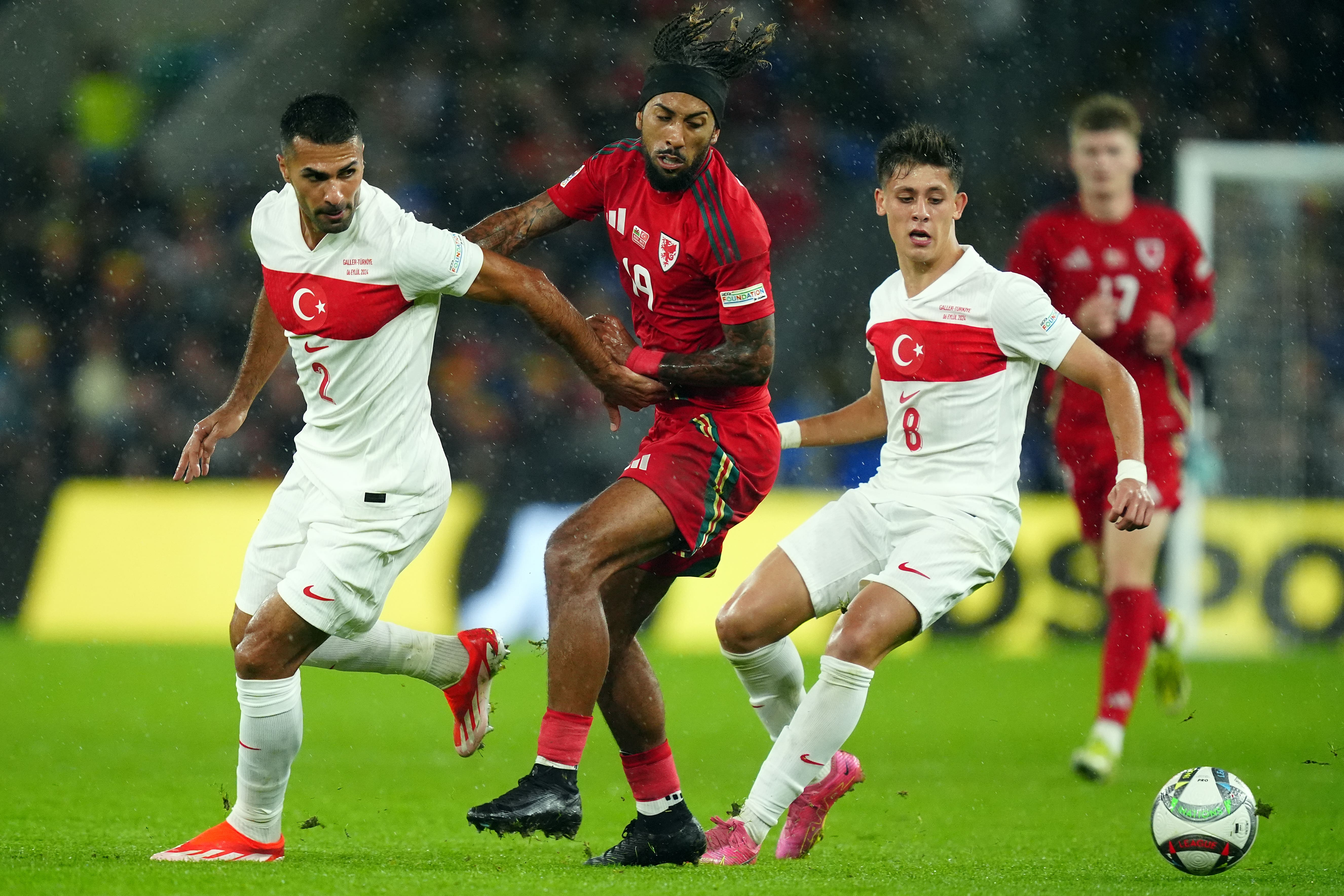 Wales’ Sorba Thomas (centre) and Turkey’s Arda Guler (right) battle for possession when the two countries met in the Nations League in September (David Davies/PA)