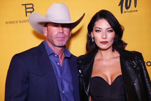 <p>Yellowstone creator Taylor Sheridan, pictured with his Utah native model wife, has brought his vision of the West to US screens and culture - while living the life and myth himself on his newly-purchased, legendary ranch in Texas </p>