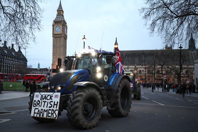 <p>Farmers drive tractors around Parliament Square during a demonstration organised by Save British Farming, March 2024 </p>