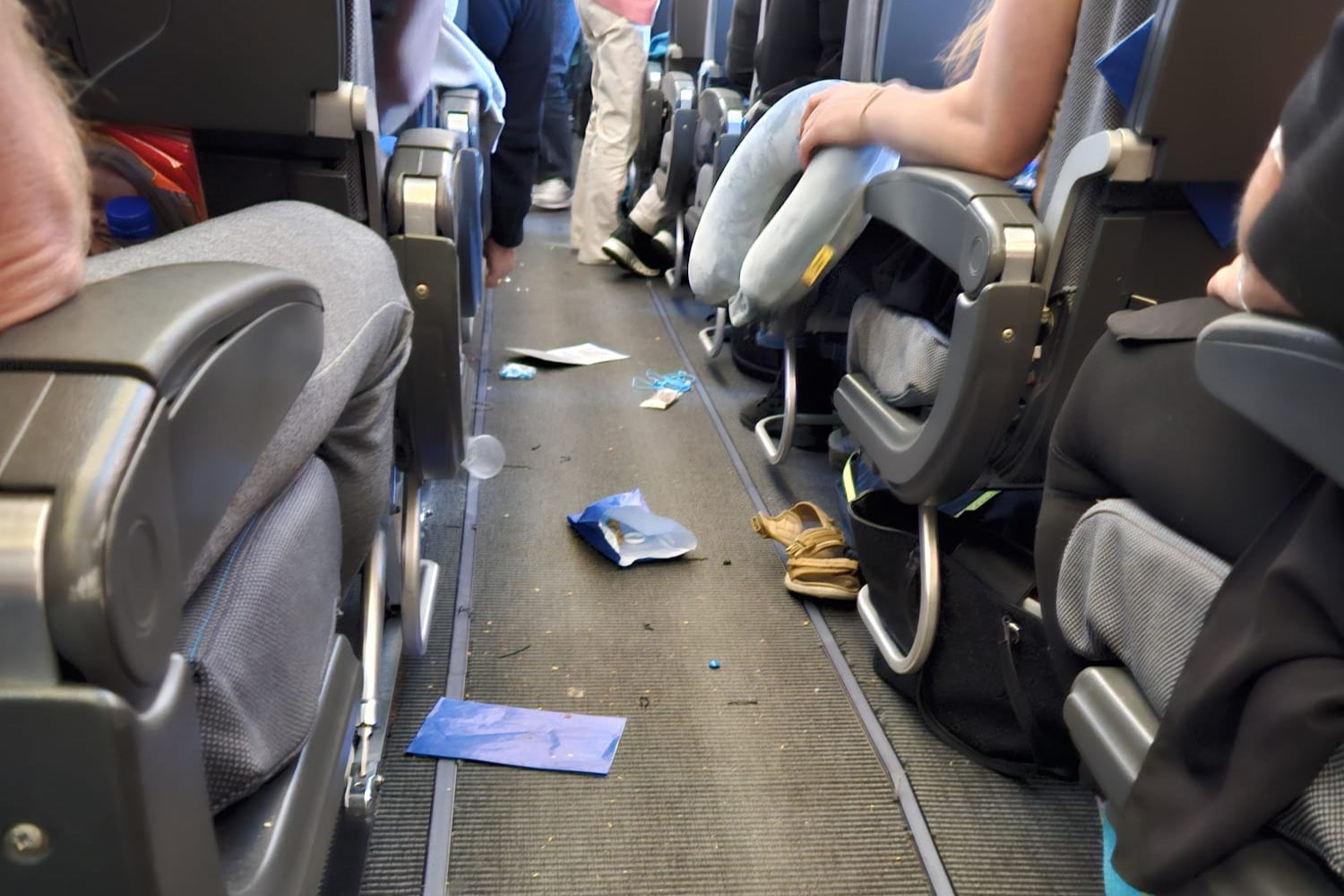 Debris fell into the plane aisle during turbulence