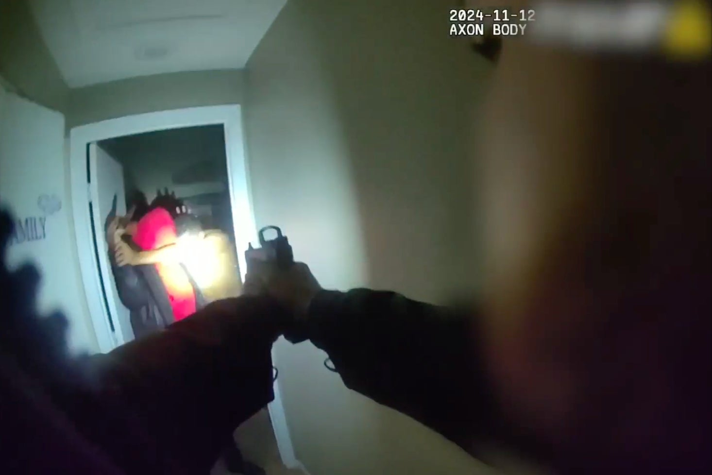 Bodycam footage showed the moment that Brandon Durham, 43, was fighting off a female intruder who was brandishing a knife at him when an officer shot him multiple times