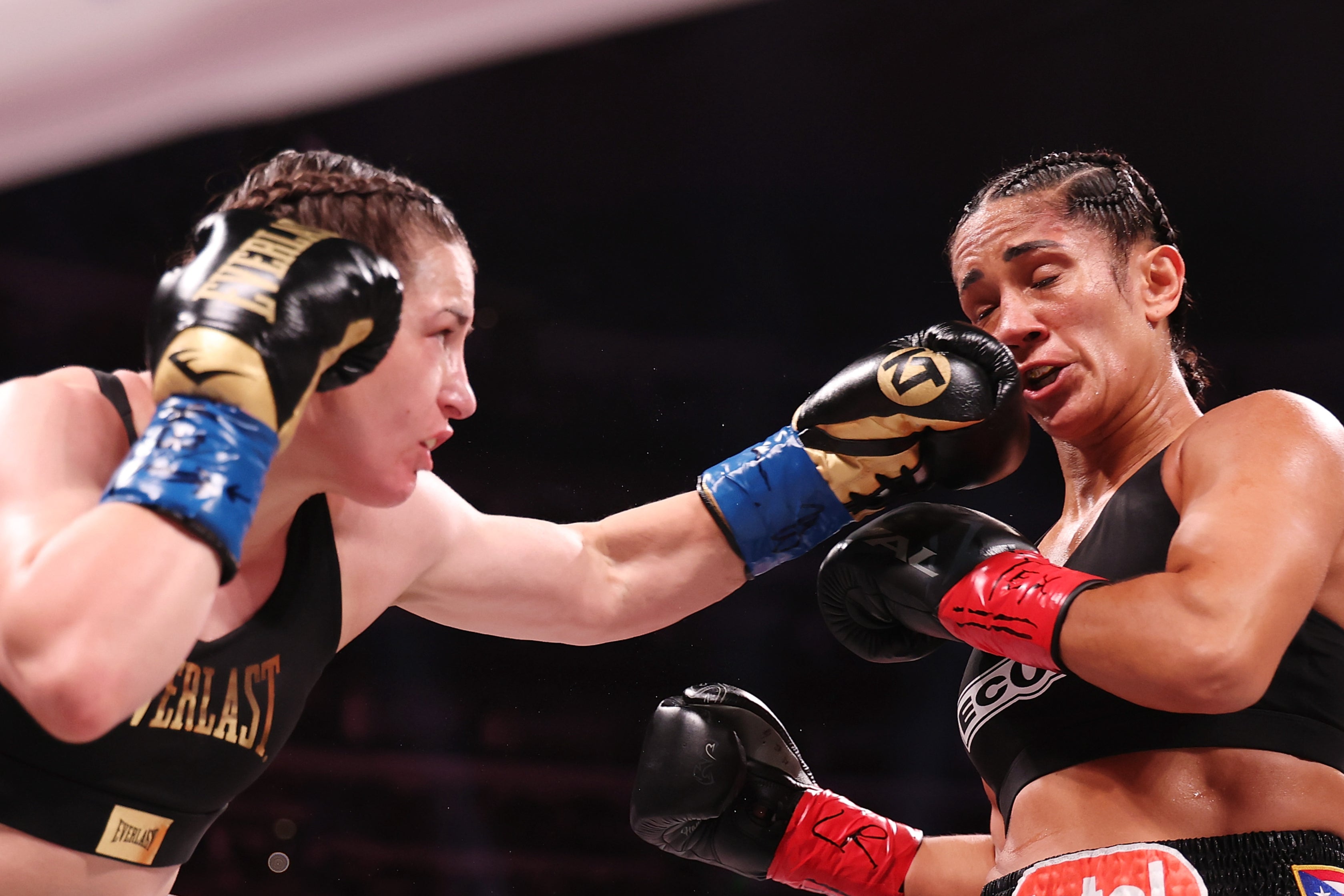 Katie Taylor (left) retained her super-lightweight titles against Amanda Serrano