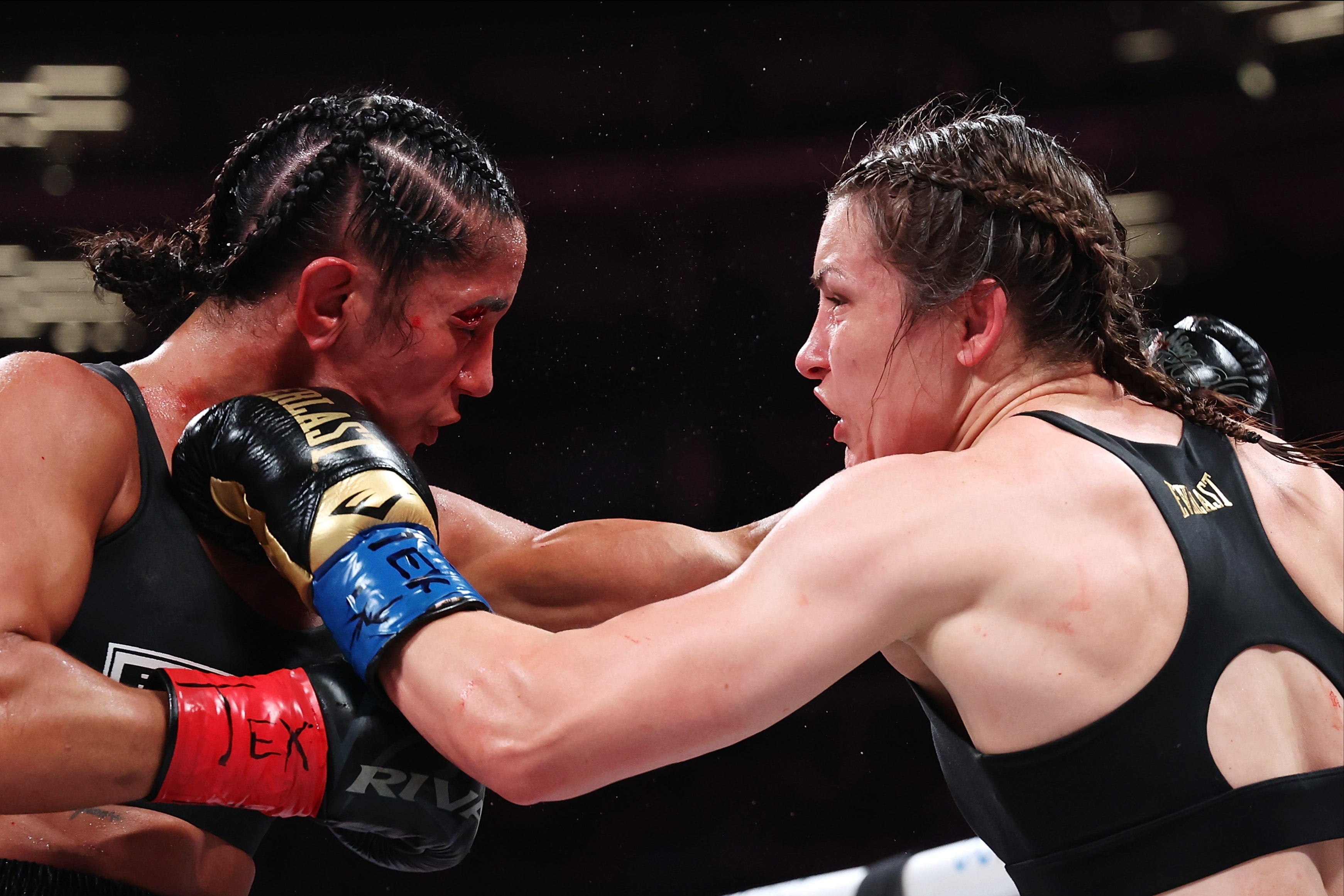 Katie Taylor (right) outpointed Amanda Serrano to retain her titles