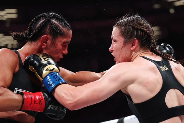 <p>Katie Taylor (right) outpointed Amanda Serrano to retain her titles</p>