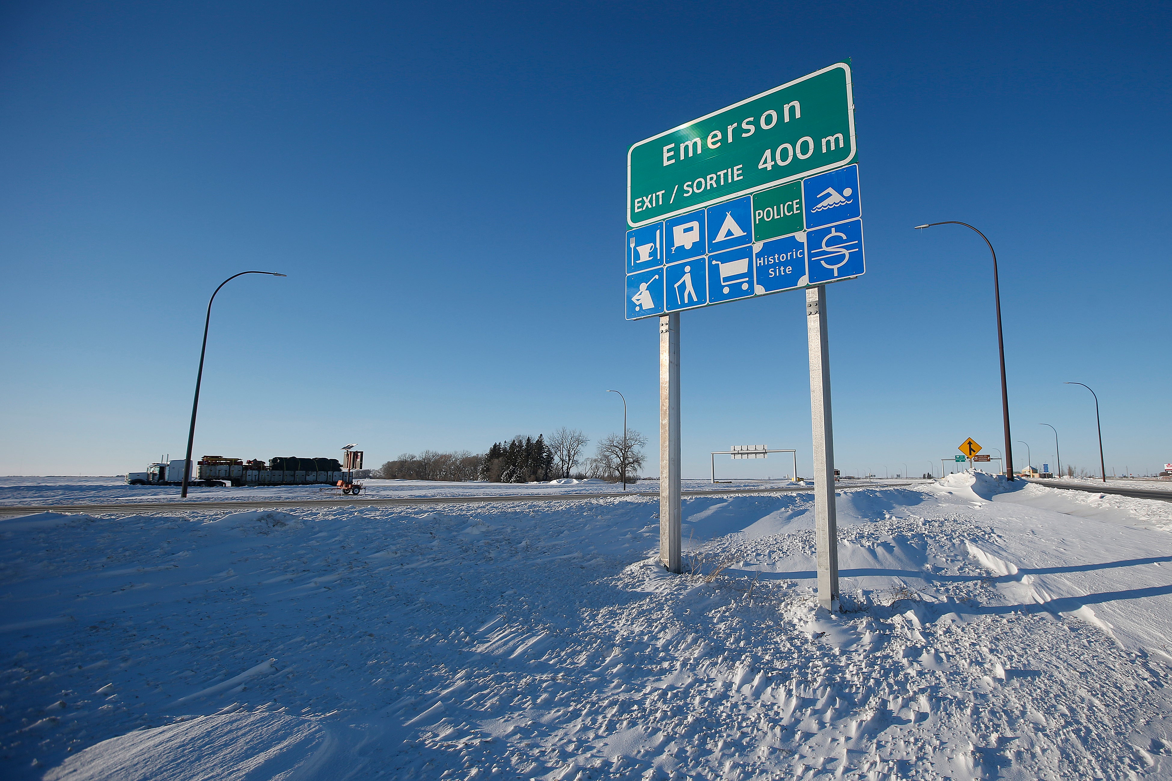 Road signage is posted just outside of Emerson, Manitoba