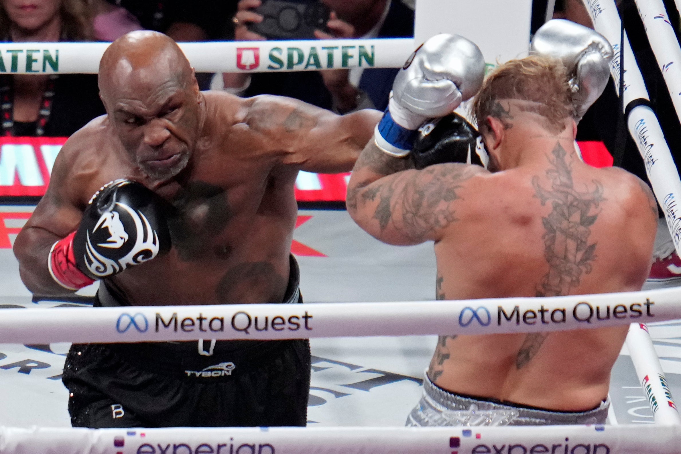 Tyson lands a left to Jake Paul during their heavyweight boxing match