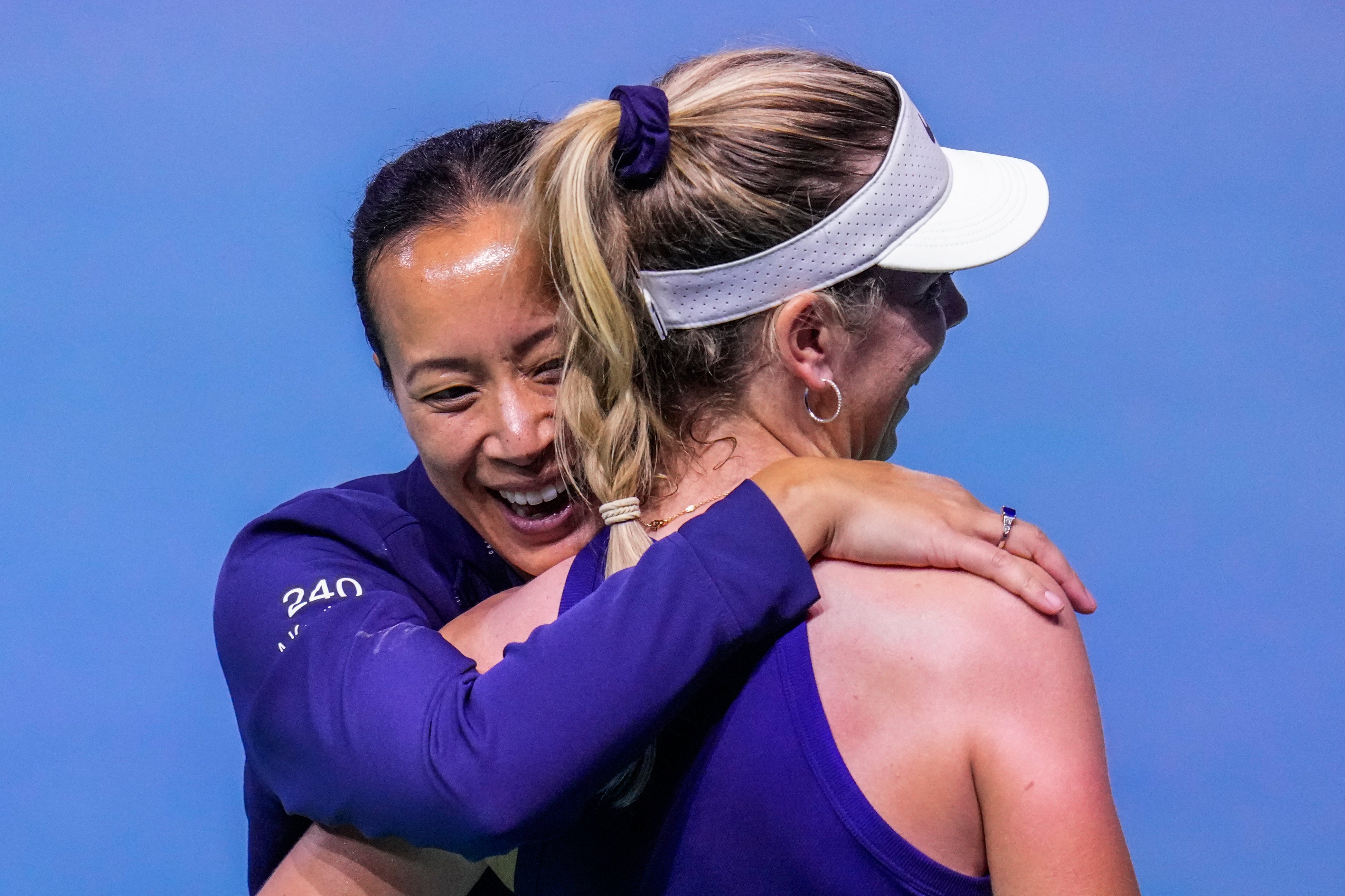 Katie Boulter, right, is embraced by captain Anne Keothavong (Manu Fernandez/AP)