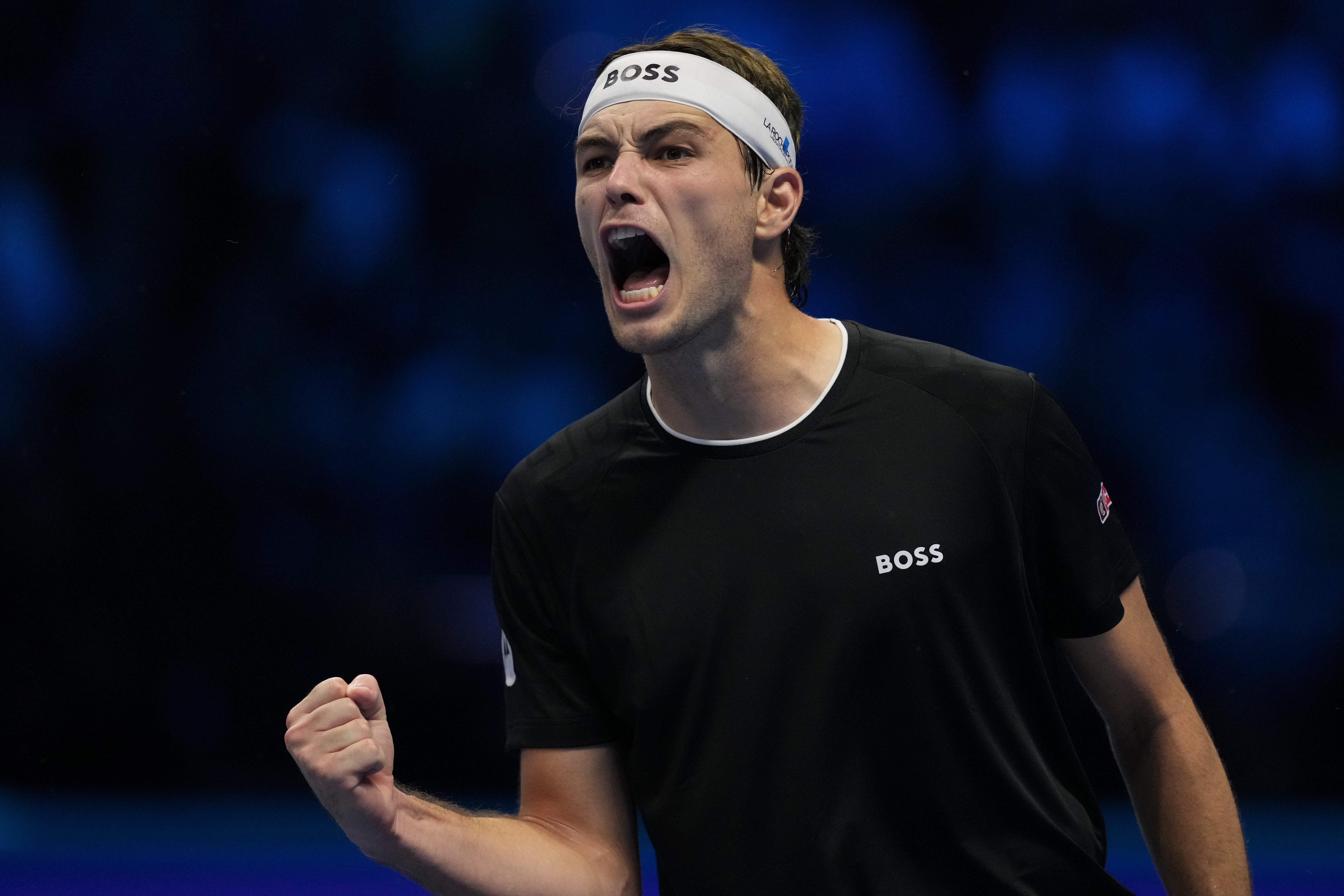 Taylor Fritz celebrates beating Alexander Zverev (Antonio Calanni/AP)