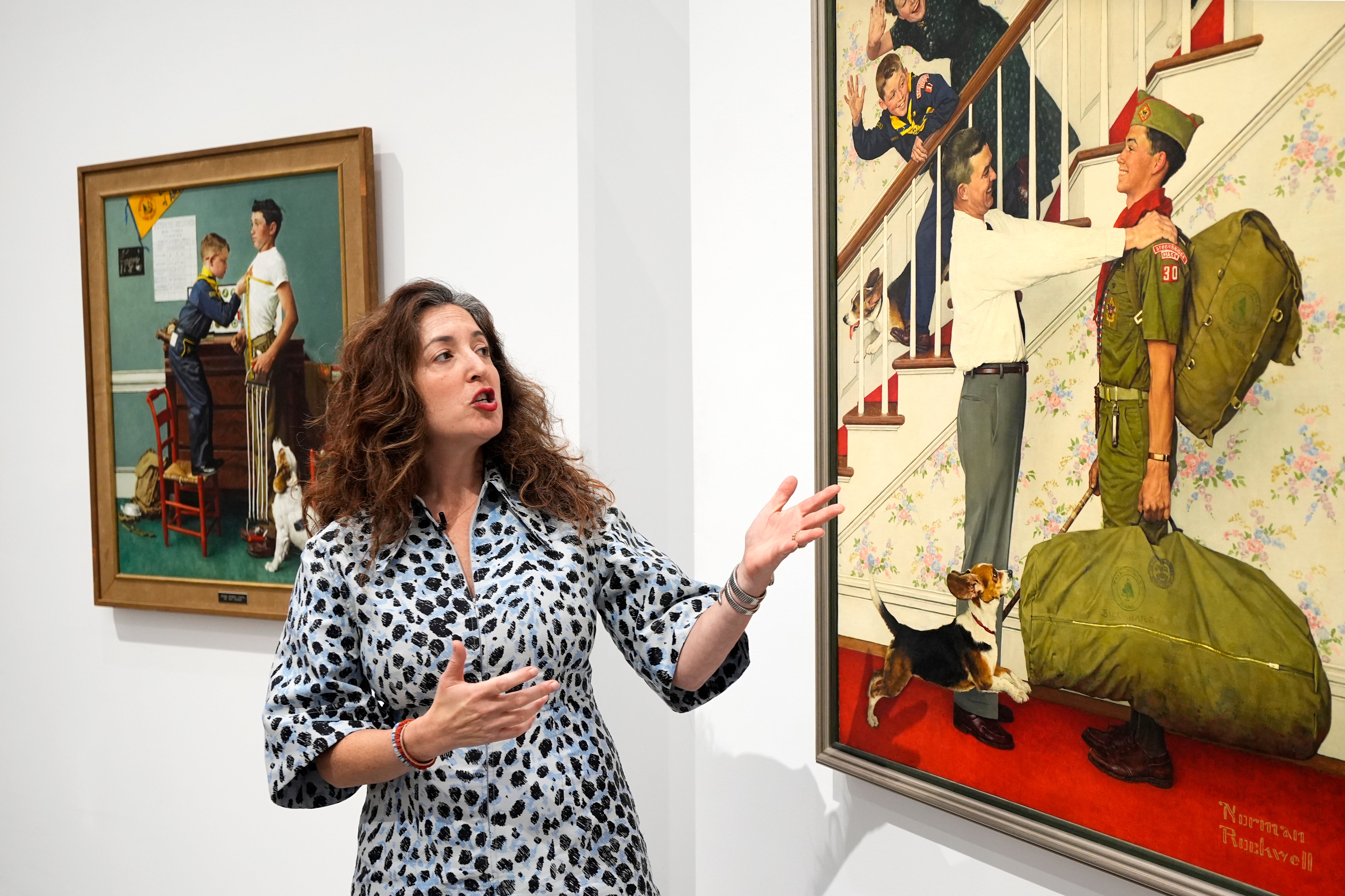 Aviva Lehmann, Heritage Auction’s senior vice president of American art with one of the paintings