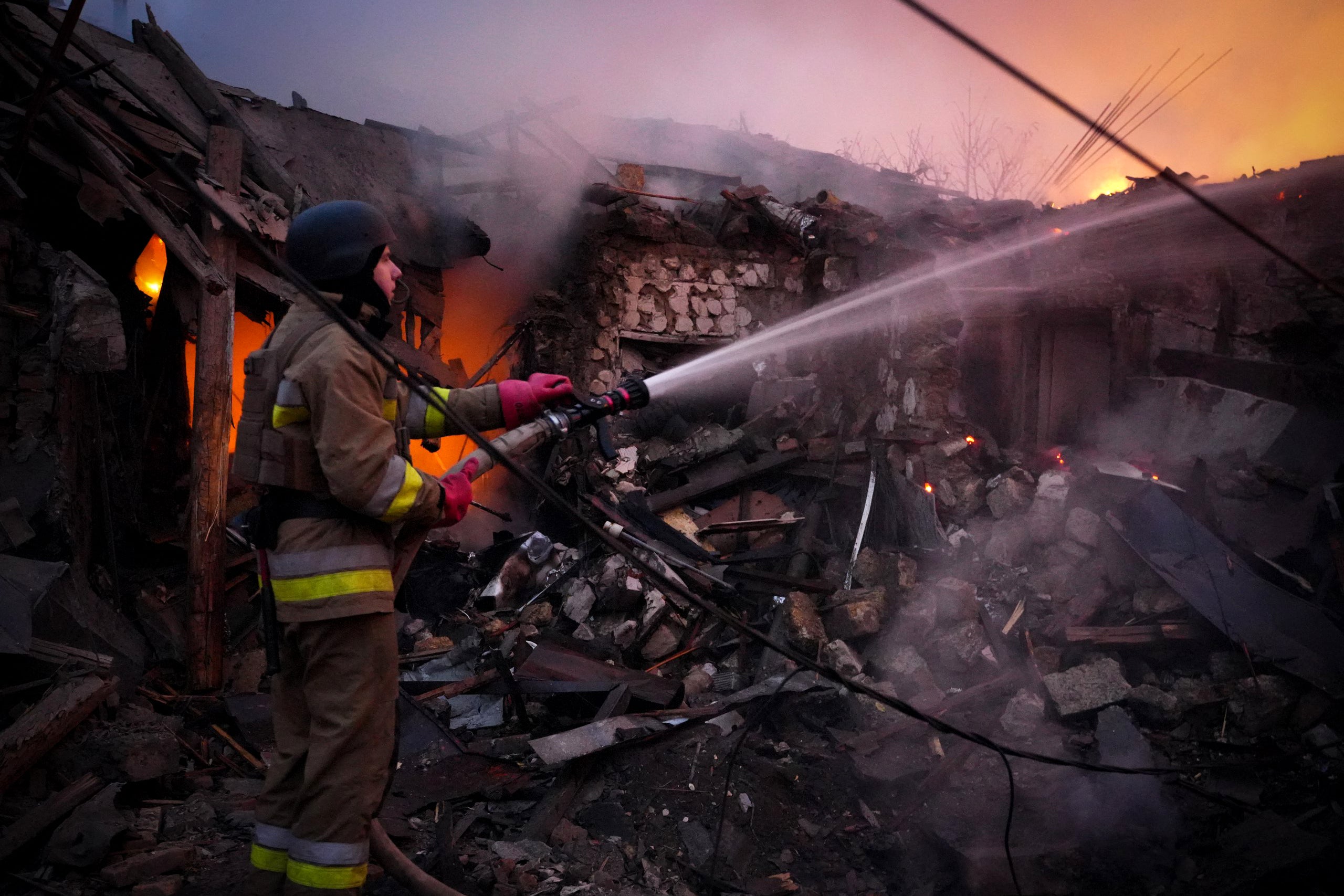 Ukrainian emergency services work at the site of one of Russia’s drone attacks on Sunday morning