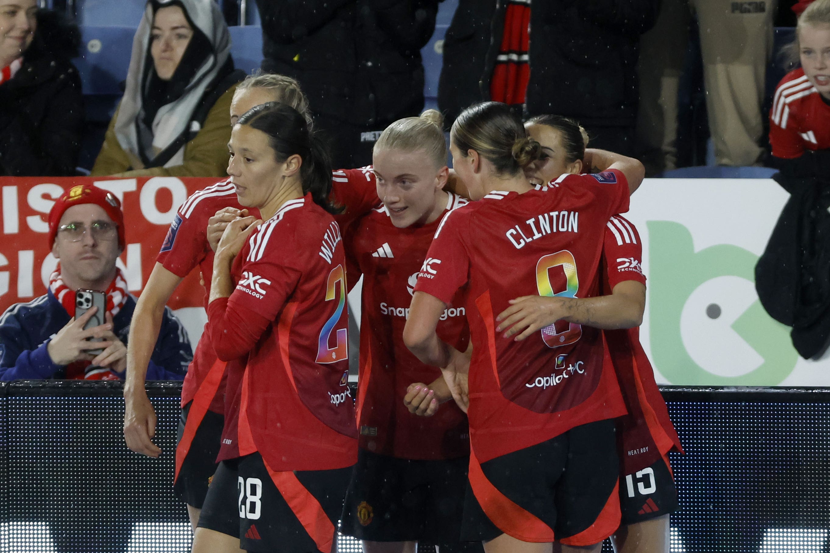 Manchester United’s players celebrate Celin Bizet’s goal at Leicester (Nigel French/PA)