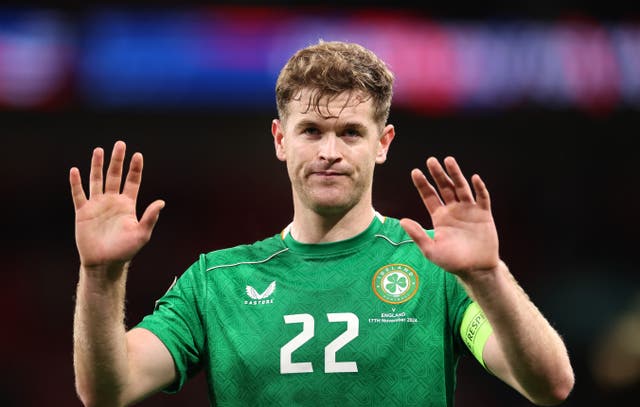 <p>Captain Nathan Collins holds up his hands after the 5-0 defeat </p>