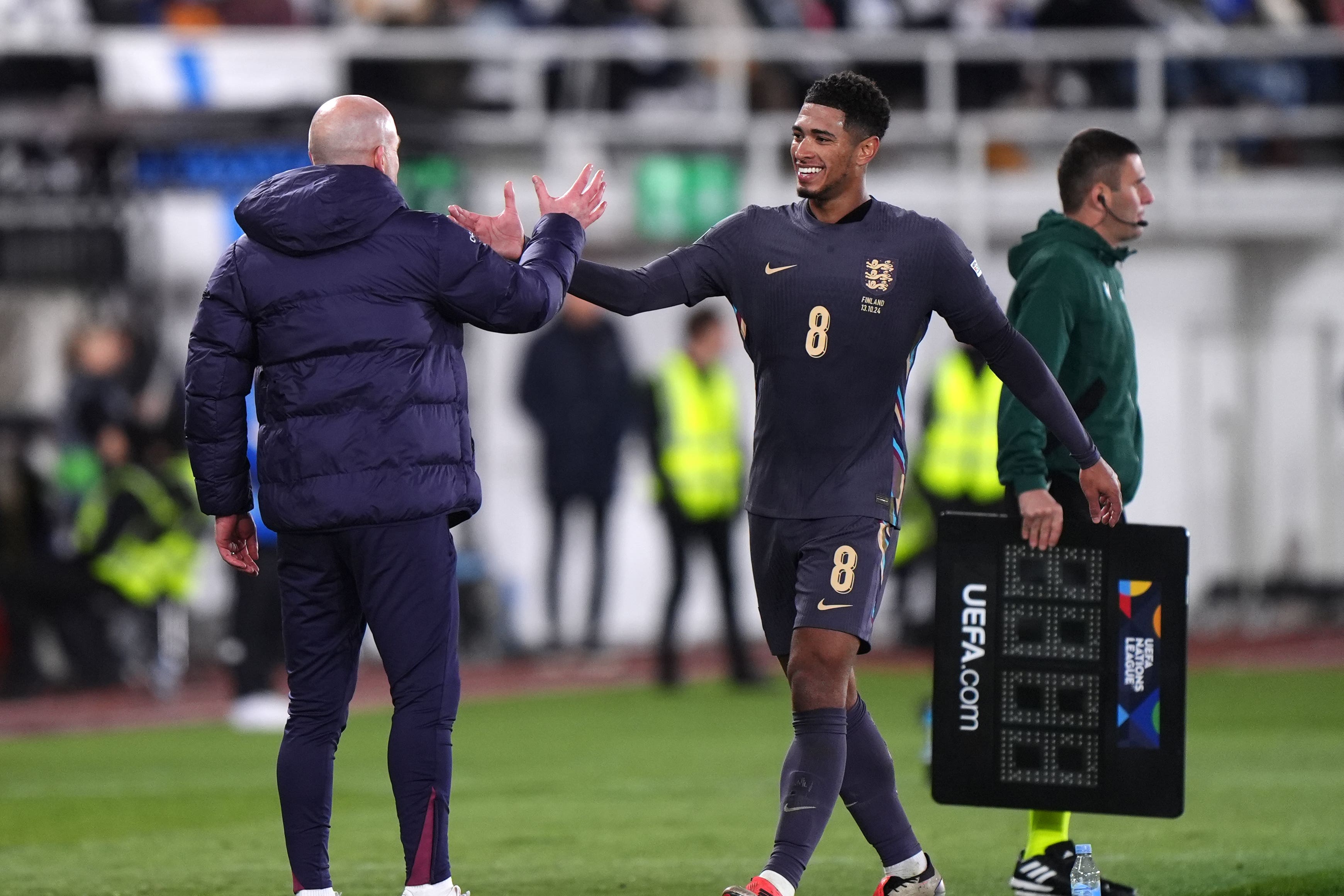 England’s Jude Bellingham greets interim manager Lee Carsley as he is substituted off during the UEFA Nations League Group B2 match at the Helsinki Olympic Stadium in Finland. Picture date: Sunday October 13, 2024.