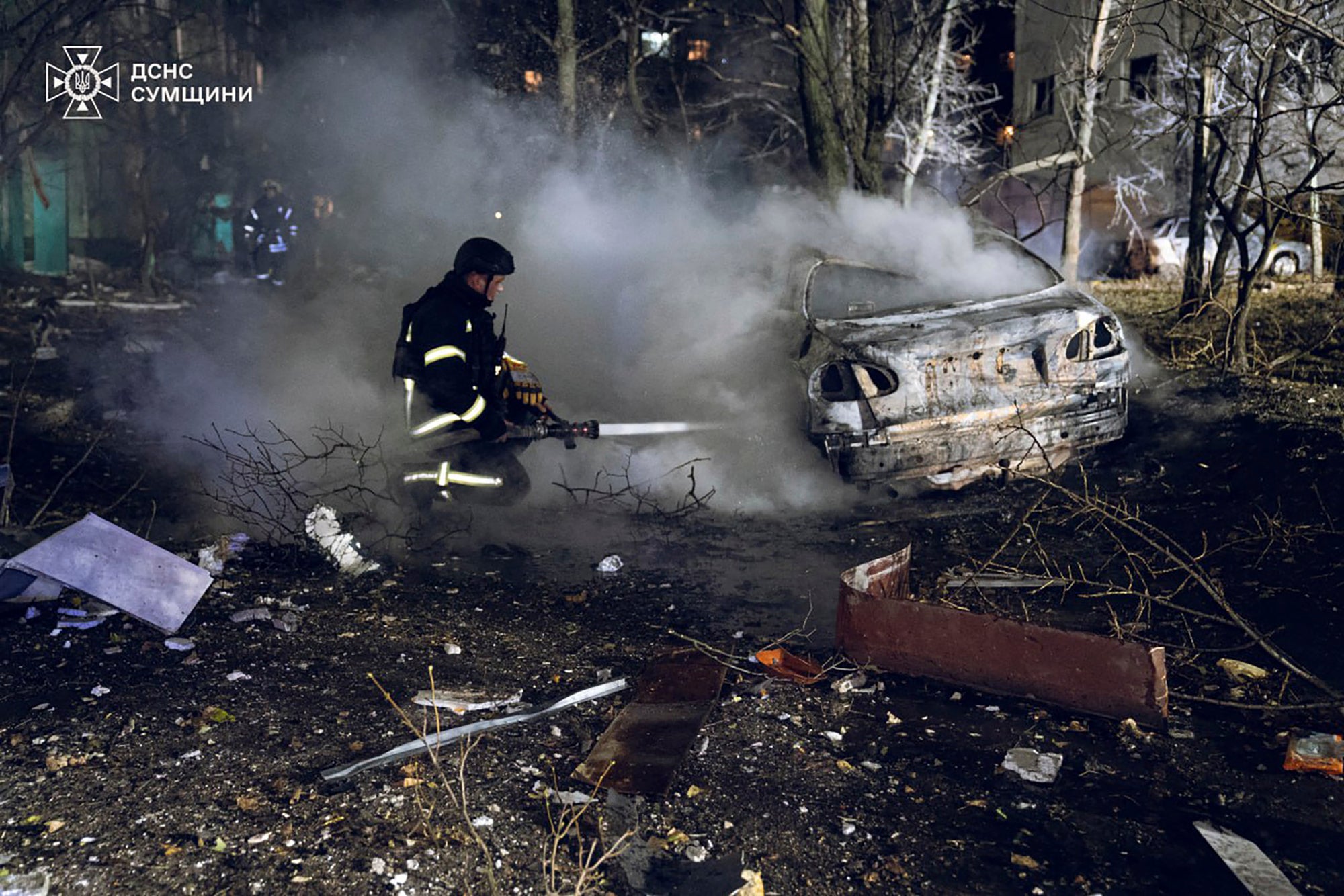 Firefighters extinguish the fire following a Russian rocket attack that hit a multi-storey apartment building in Sumy, Ukraine, Sunday, Nov. 17, 2024