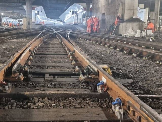 <p>Close encounter: Network Rail engineers at Liverpool Street station in London</p>