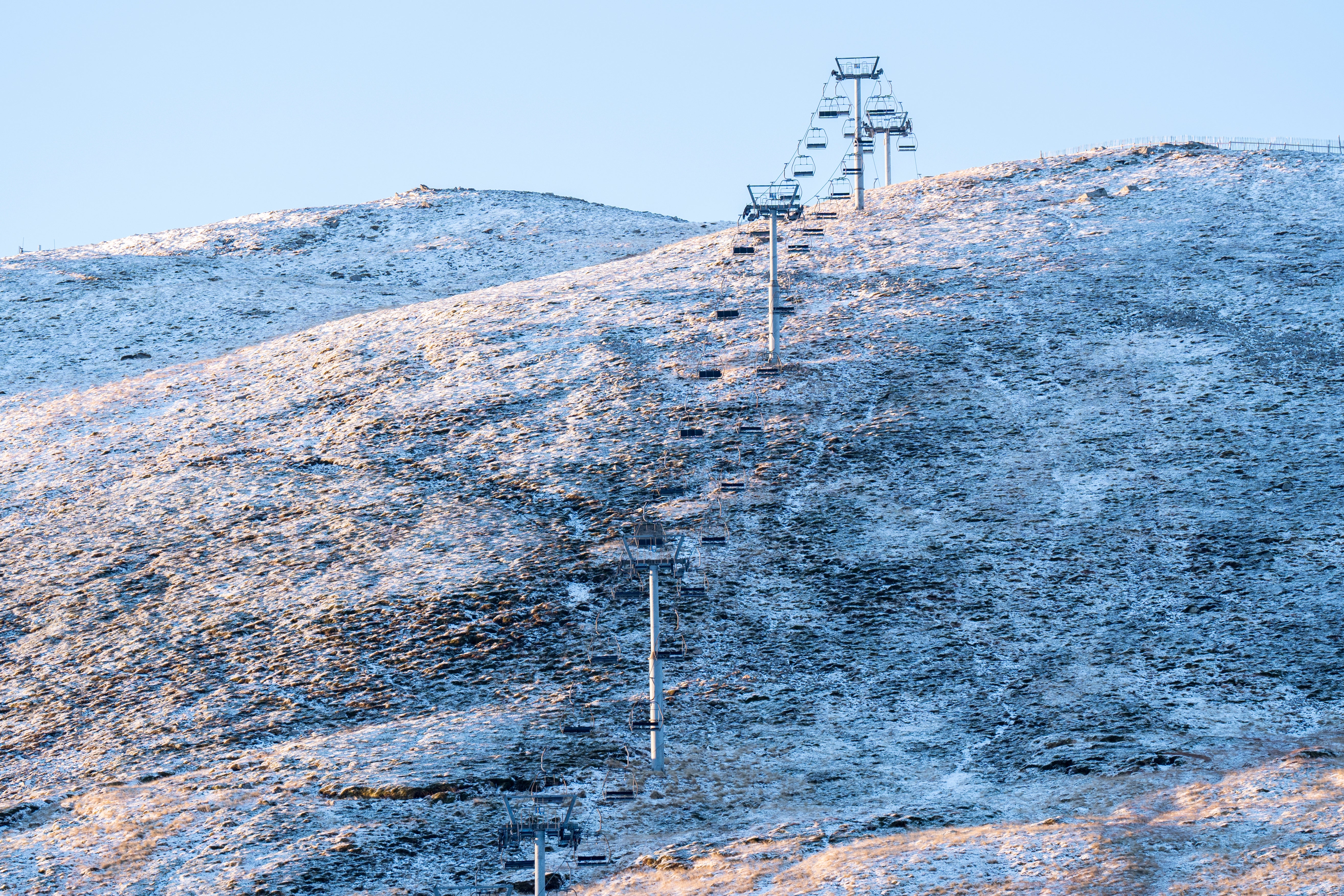 A dusting of snow surrounds the chair-lift at the Glenshee Ski Centre near Braemar in Aberdeenshire