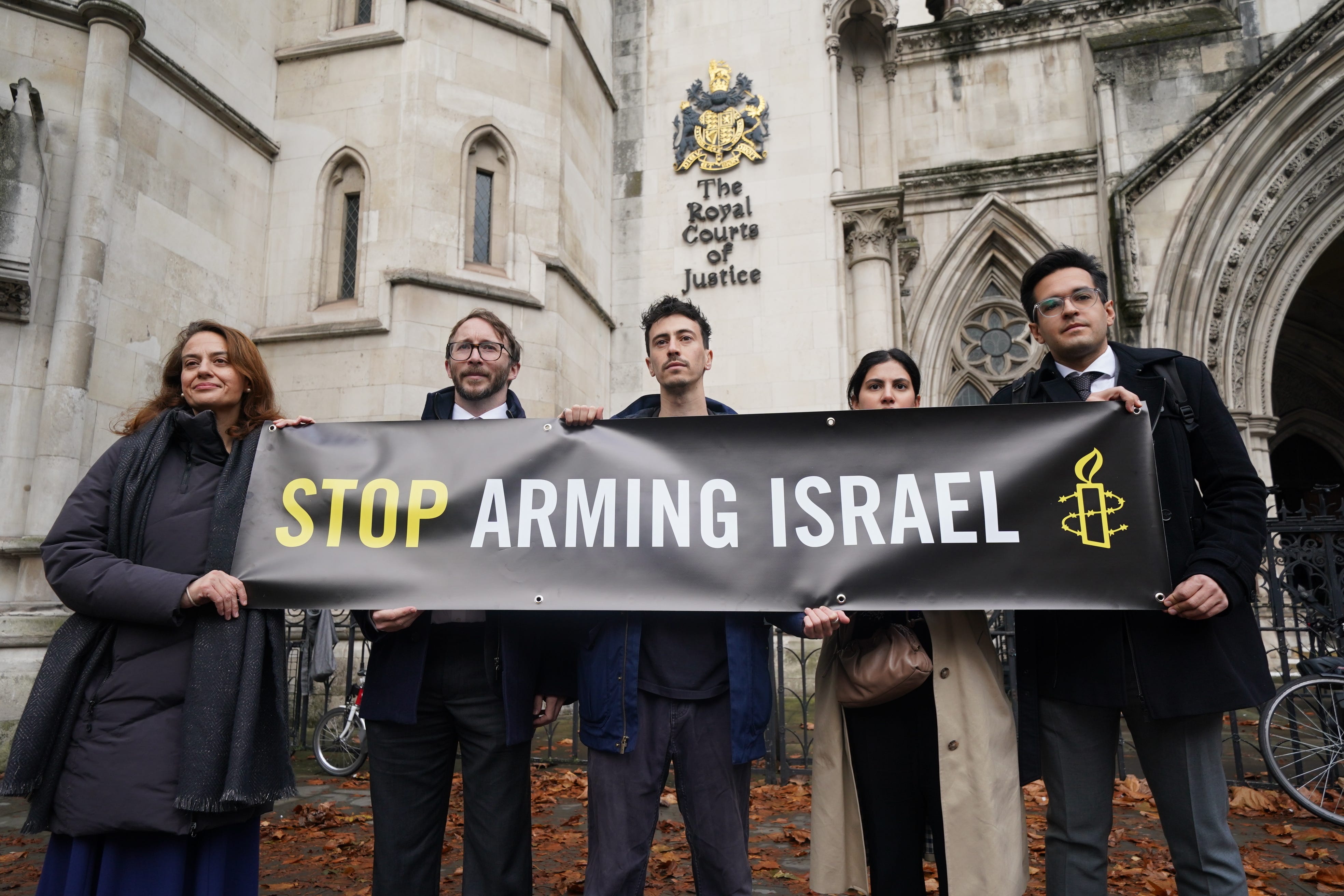 Campaigners outside the High Court in London where Al-Haq is taking legal action against the Department for Business and Trade over decisions not to suspend licences for the export of weapons and military equipment to Israel (Lucy North/PA)