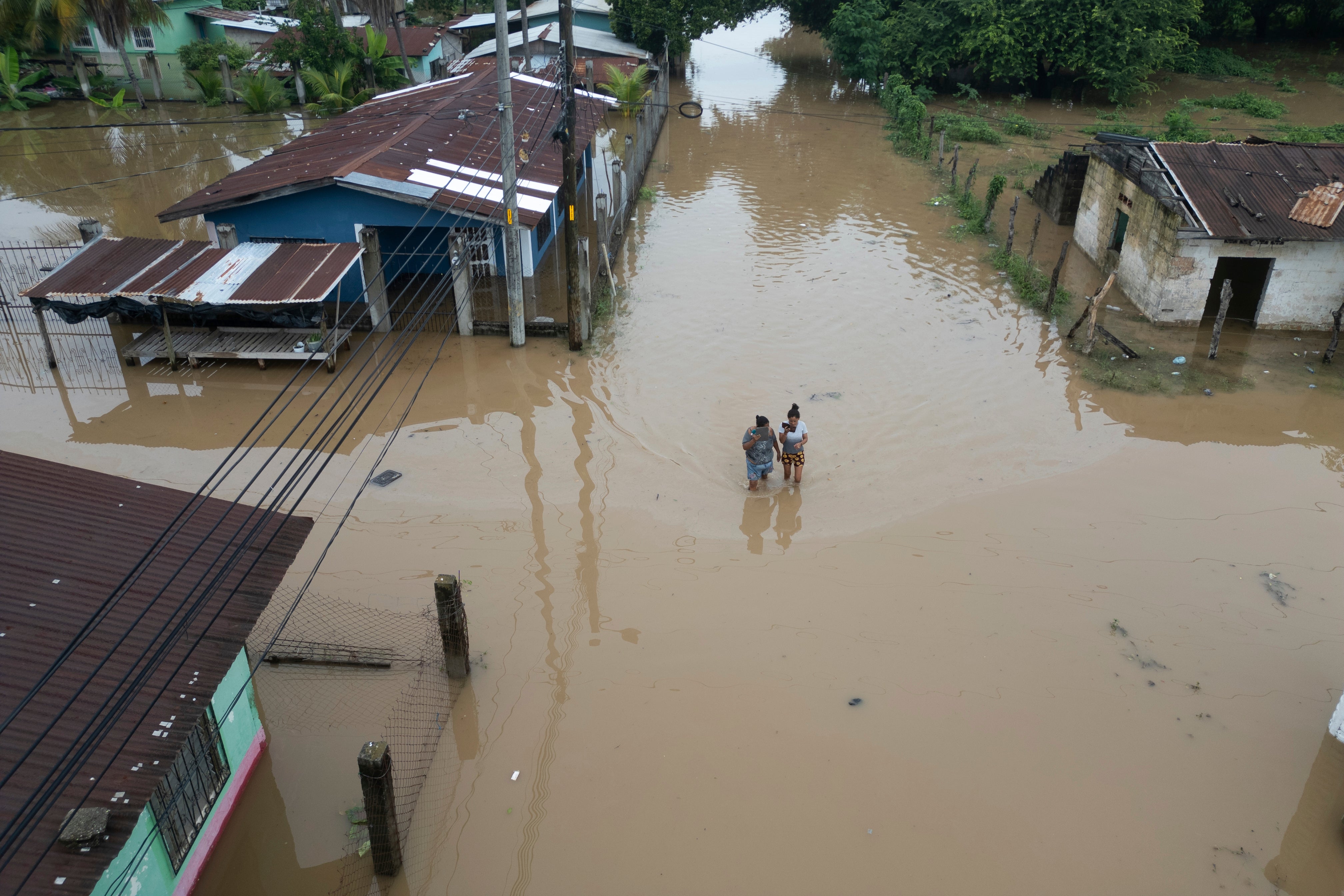 An aerial view of the Suyapa neighborhood, partially flooded after Tropical Storm Sara, in Potrerillos, Honduras, over the weekend. Sara, which has dissipated, is moving toward the Gulf of Mexico.