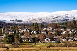 Snow on the hills above the town of Kingussie in the Cairngorms