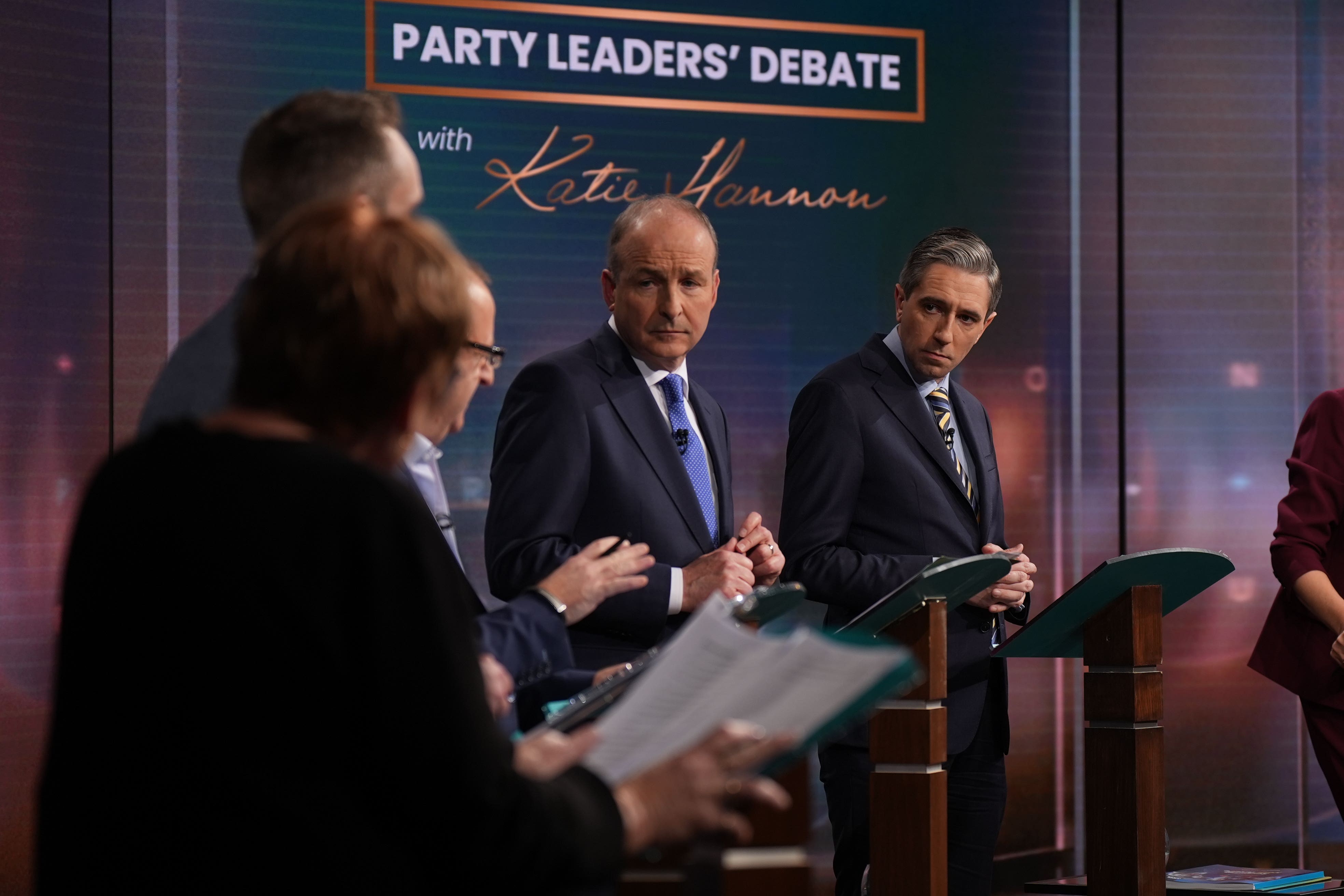 Taoiseach and leader of Fine Gael, Simon Harris (right) and Tanaiste and leader of Fianna Fail, Micheal Martin (second right) during the General Election leaders’ debate at RTE studios in Montrose, Dublin (Niall Carson/PA)