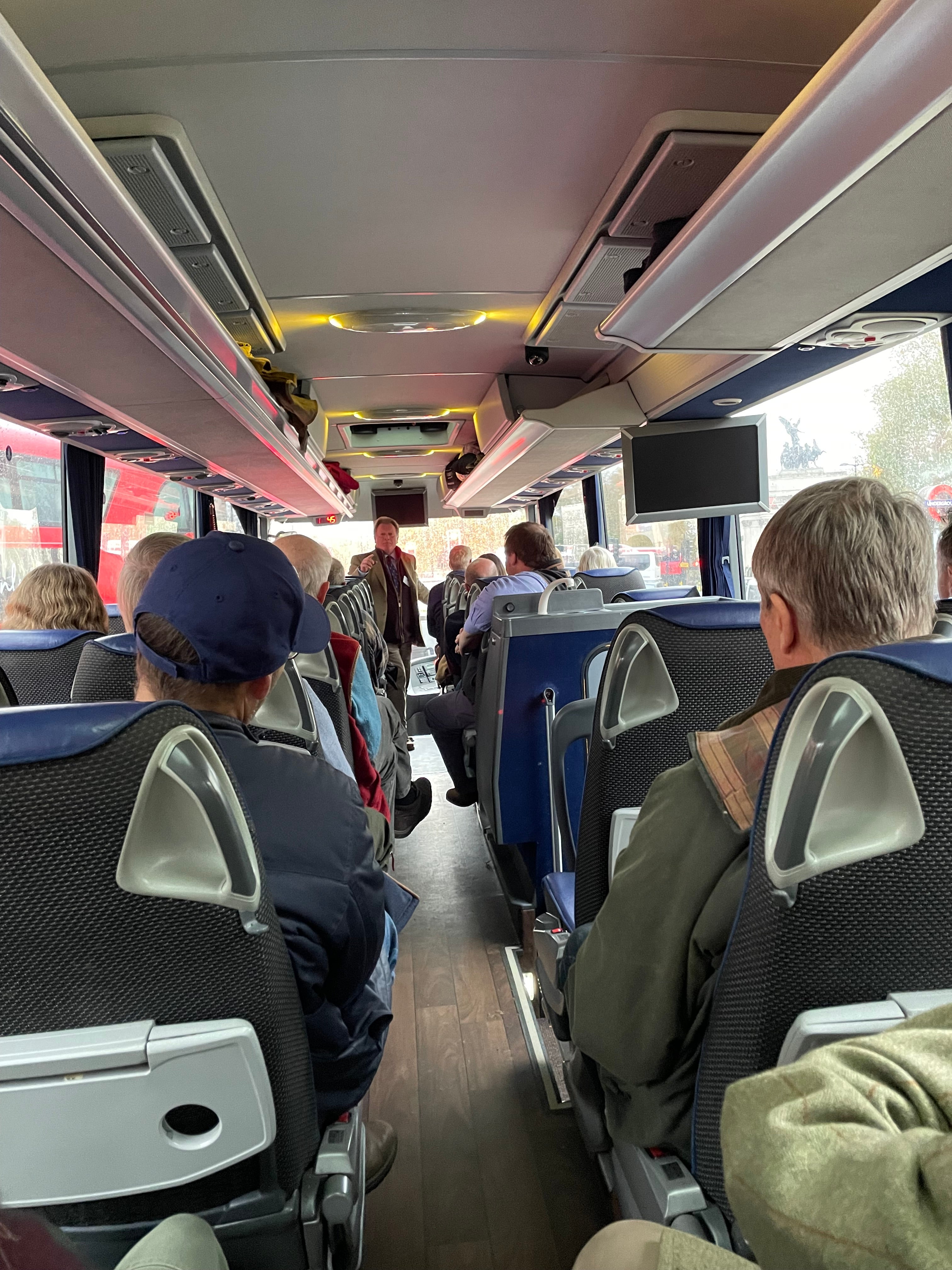 NFU official Chris Farr speaks to the bus-load of farmers as they arrive in London