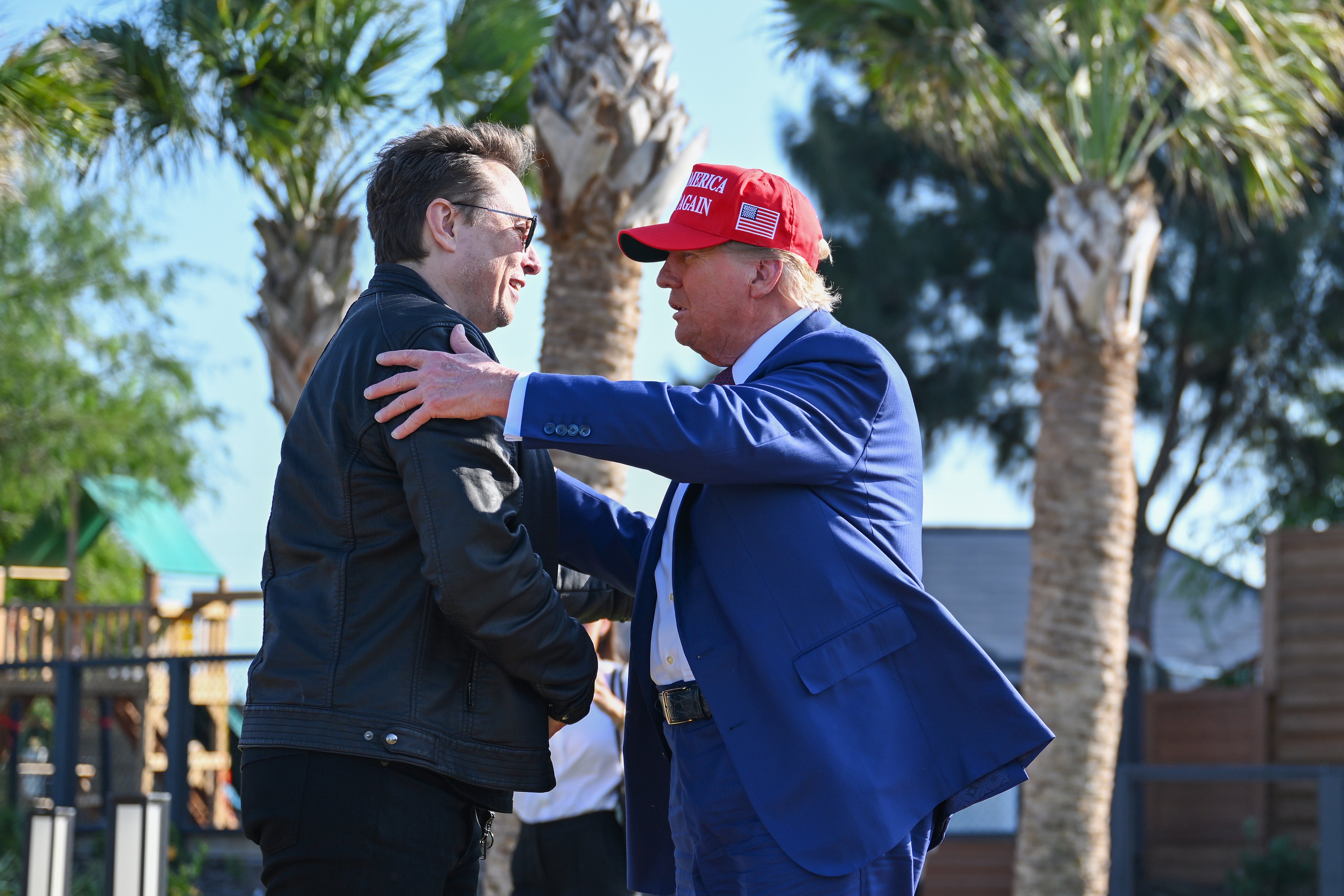 Donald Trump greets Elon Musk as he arrives to attend a viewing of the launch of the sixth test flight of the SpaceX Starship rocket