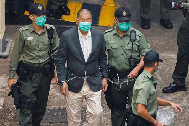 <p>File: Media mogul Jimmy Lai Chee-ying, founder of Apple Daily, walks to a prison van to head to court</p>