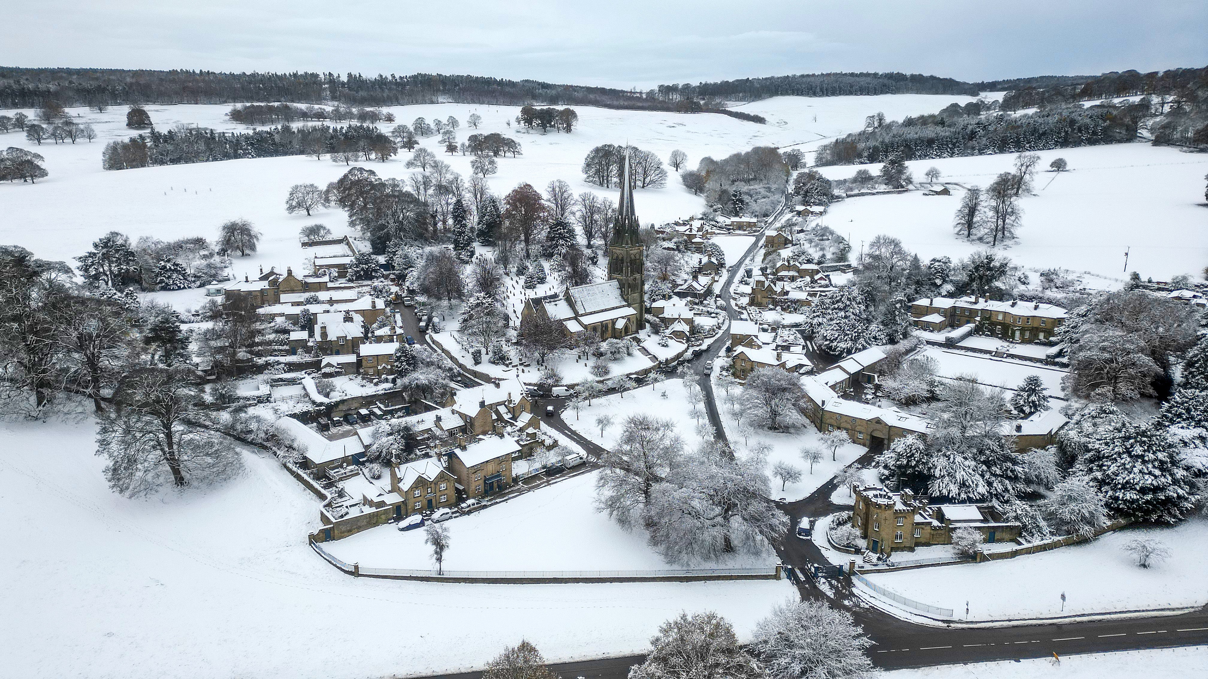 In this aerial view snow covers the Derbyshire village of Edensor on 19 November 2024 in Chatsworth, United Kingdom