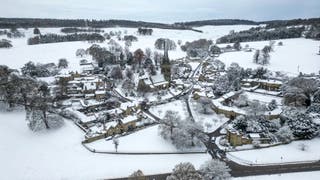 In this aerial photo, snow blankets the Derbyshire village of Edensor on November 19, 2024 in Chatsworth, UK