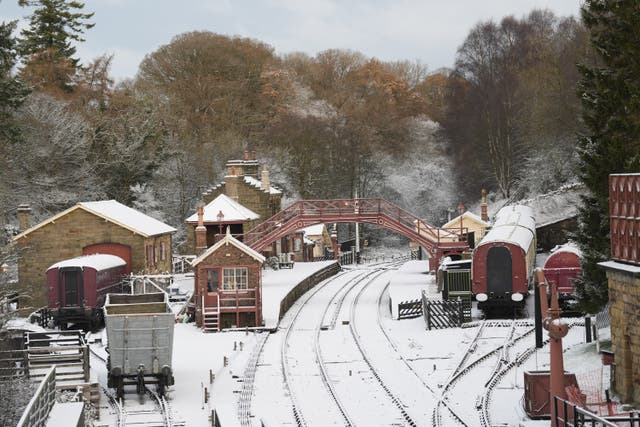 A view of the snow covered rail tracks and platforms at Goathland train station in North Yorkshire. There is widespread travel disruption after heavy snowfall and ice affected parts of the UK, with the Met Office advising vehicles could be stranded, power cuts may occur and rural areas could be cut off. Picture date: Wednesday November 20, 2024. PA.