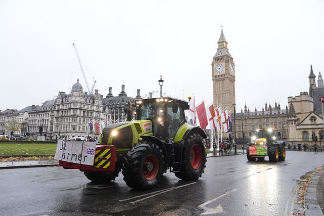 <p>Farmers in tractors drove in Parliament Square, London, ahead of a protest on Tuesday over changes to inheritance tax rules (Andrew Matthews/PA)</p>