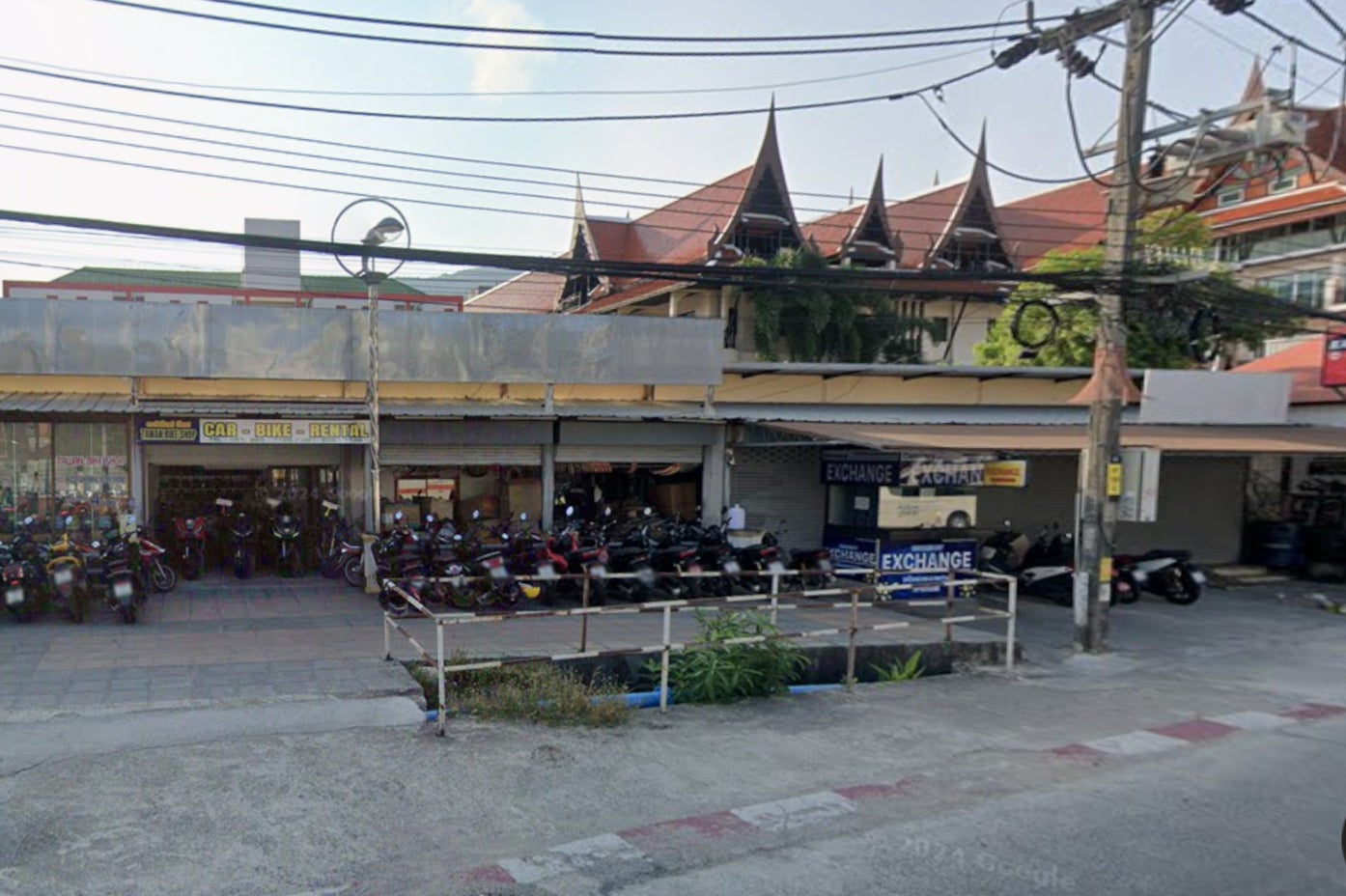 The open sewer outside the motorbike rental store where Mr Wright’s body was found