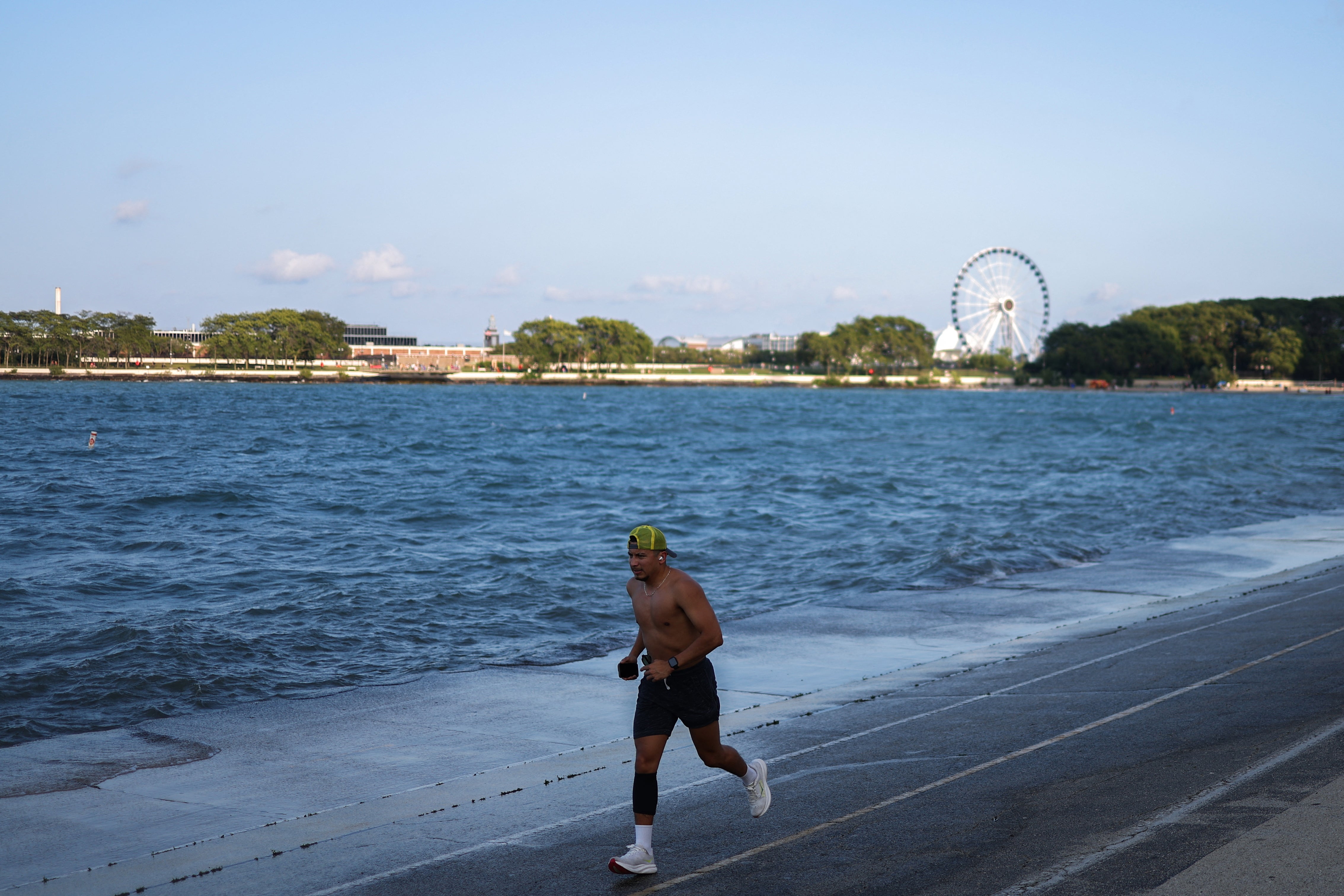 A man runs on the banks of Lake Michigan in Chicago, last August. Lake Michigan is part of the Great Lakes-St. Lawrence River Basin: one of the world’s largest sources of freshwater. Freshwater has been ‘abruptly’ disappearing over the past decade, NASA says