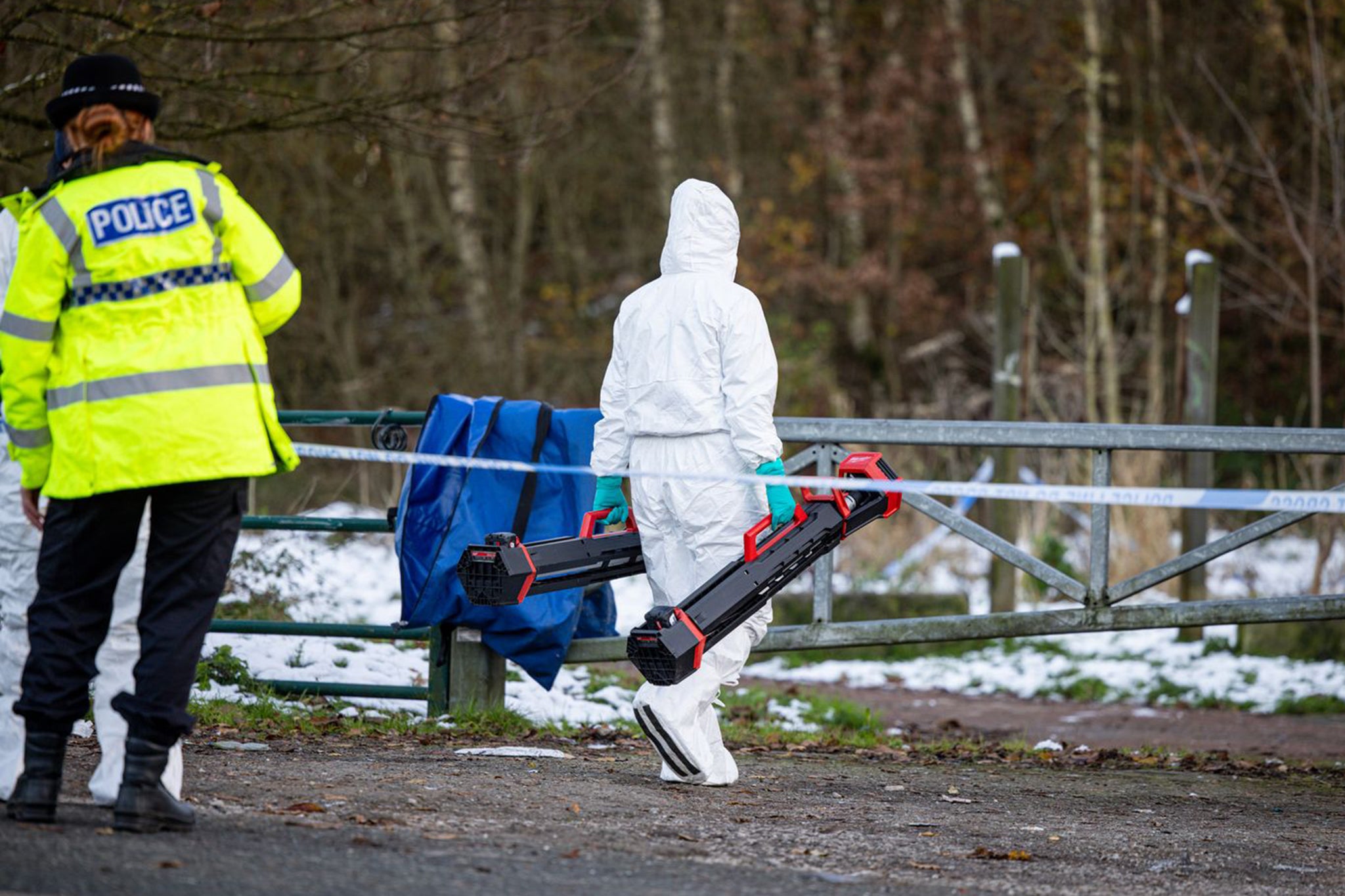 Forensics officers looked for clues at the scene