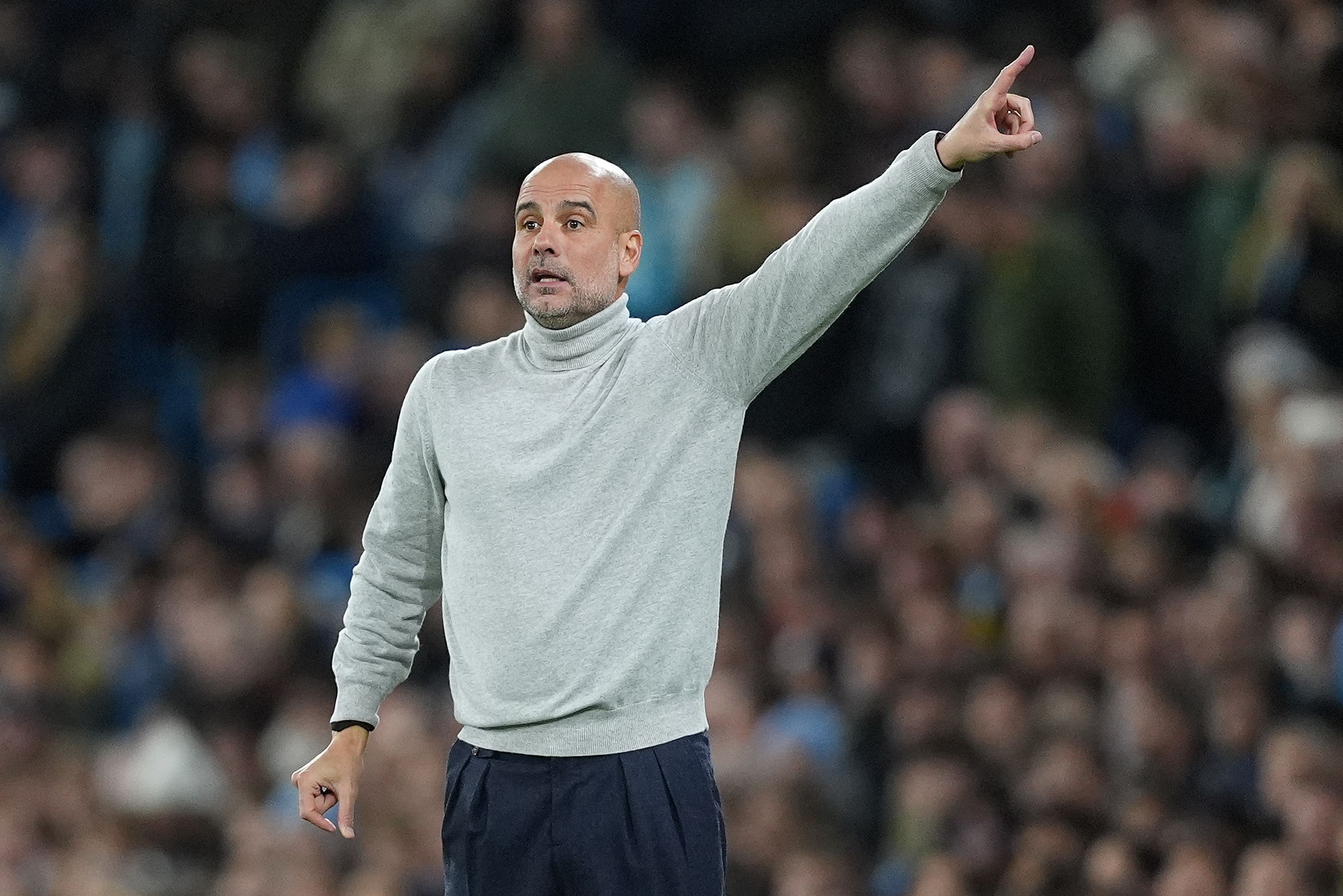 Pep Guardiola is poised to extend his contract at Manchester City (Martin Rickett/PA)