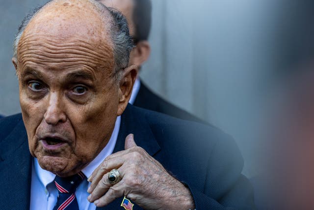 <p>Outside a federal courthouse in New York on November 7, Rudy Giuliani denied defaming two women a jury awarded nearly $150 million over his false claims </p>