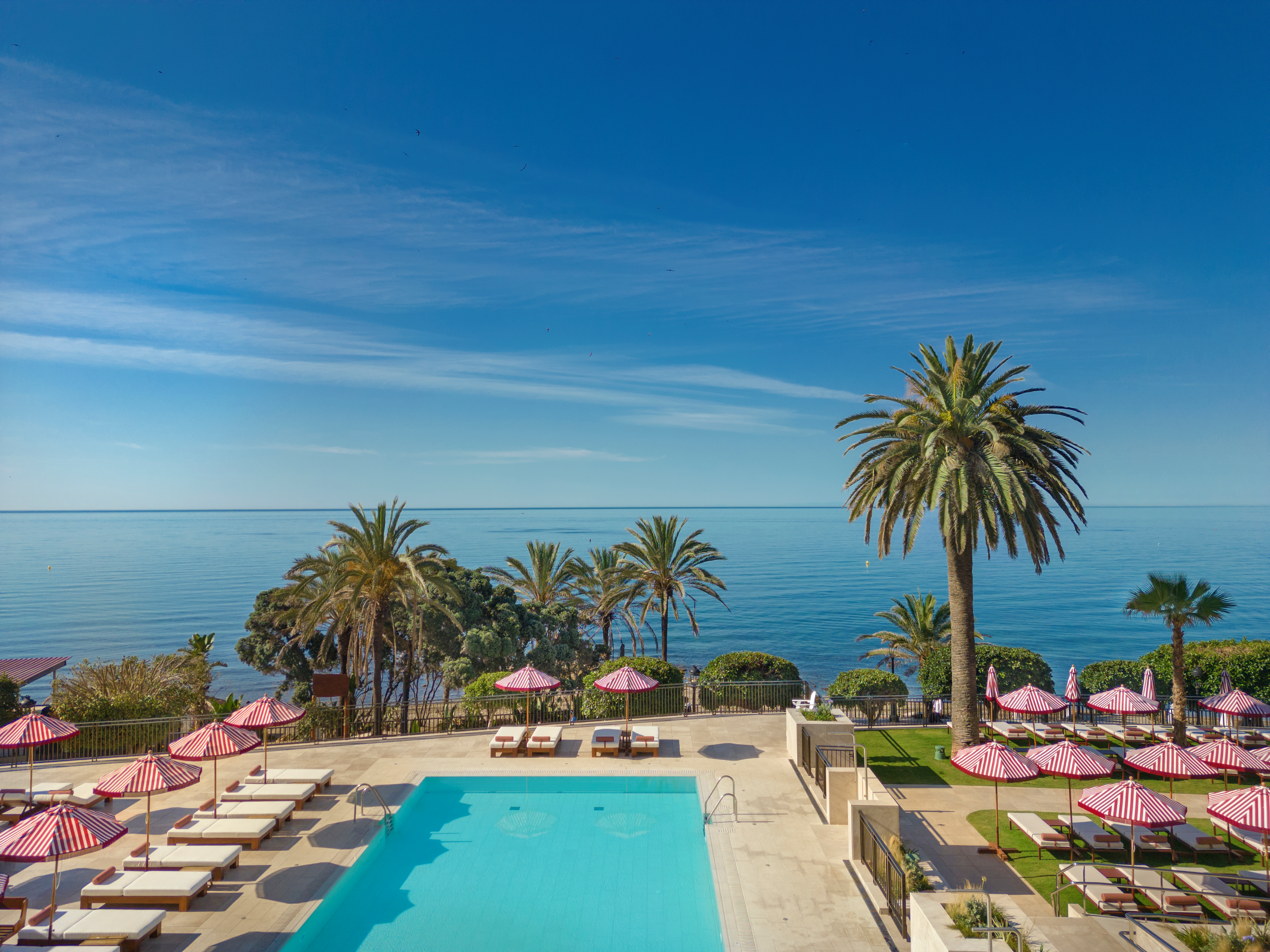 The main swimming pool boasts sea views