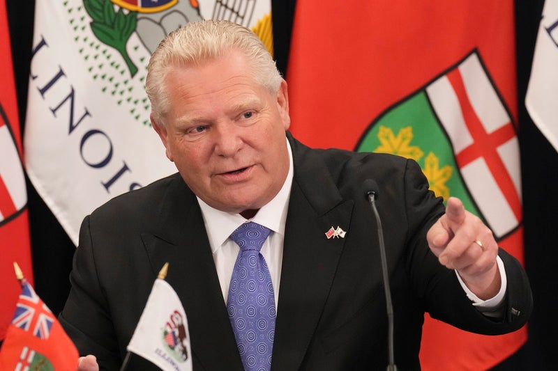 Ontario premier threatens to ban US liquor in stores, shut off power to Americans on border