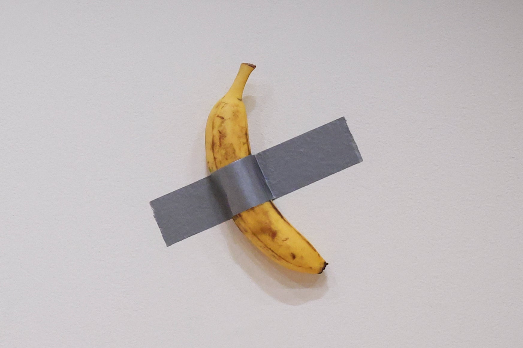 Italian visual artist Maurizio Cattelan's duct-taped Banana entitled "Comedian," displayed during a media preview at Sotheby's in New York, on November 8, 2024