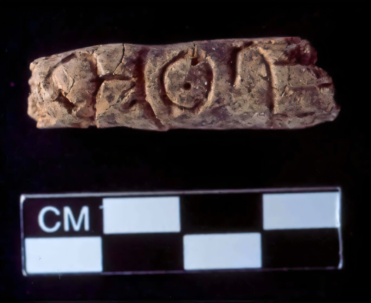 Symbols on finger-sized clay objects discovered during dig at ancient city of Umm el-Marra could be earliest known alphabet