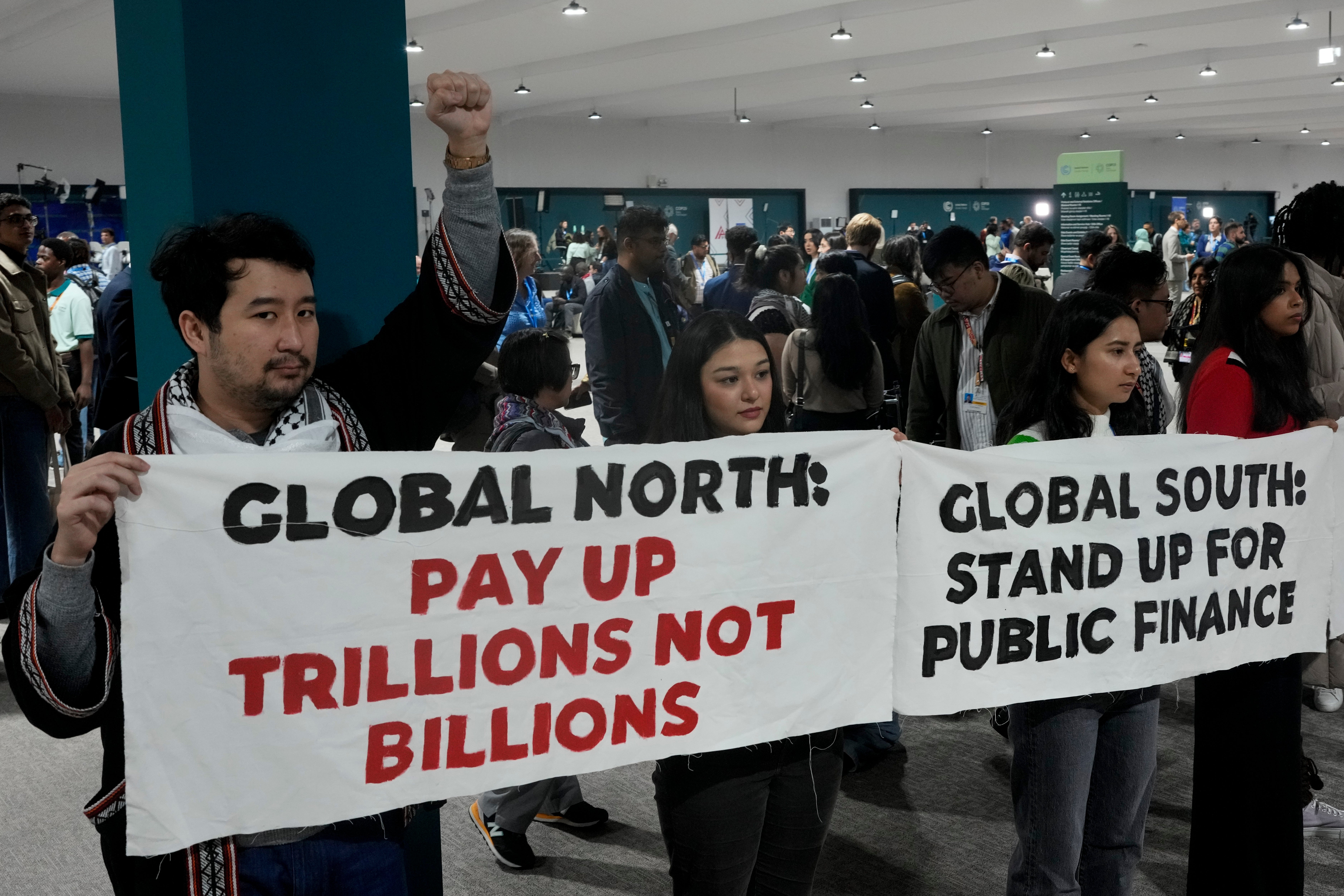 Activists demonstrate for climate finance at the Cop29 UN Climate Summit (AP Photo/Rafiq Maqbool)