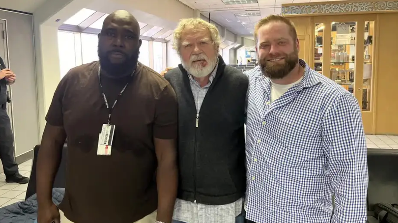 Doug McCright, center, Charlie Boris, right, and another man duct-taped another passenger and held him down for 30 mins after he attempted to open an aircraft door mid-flight