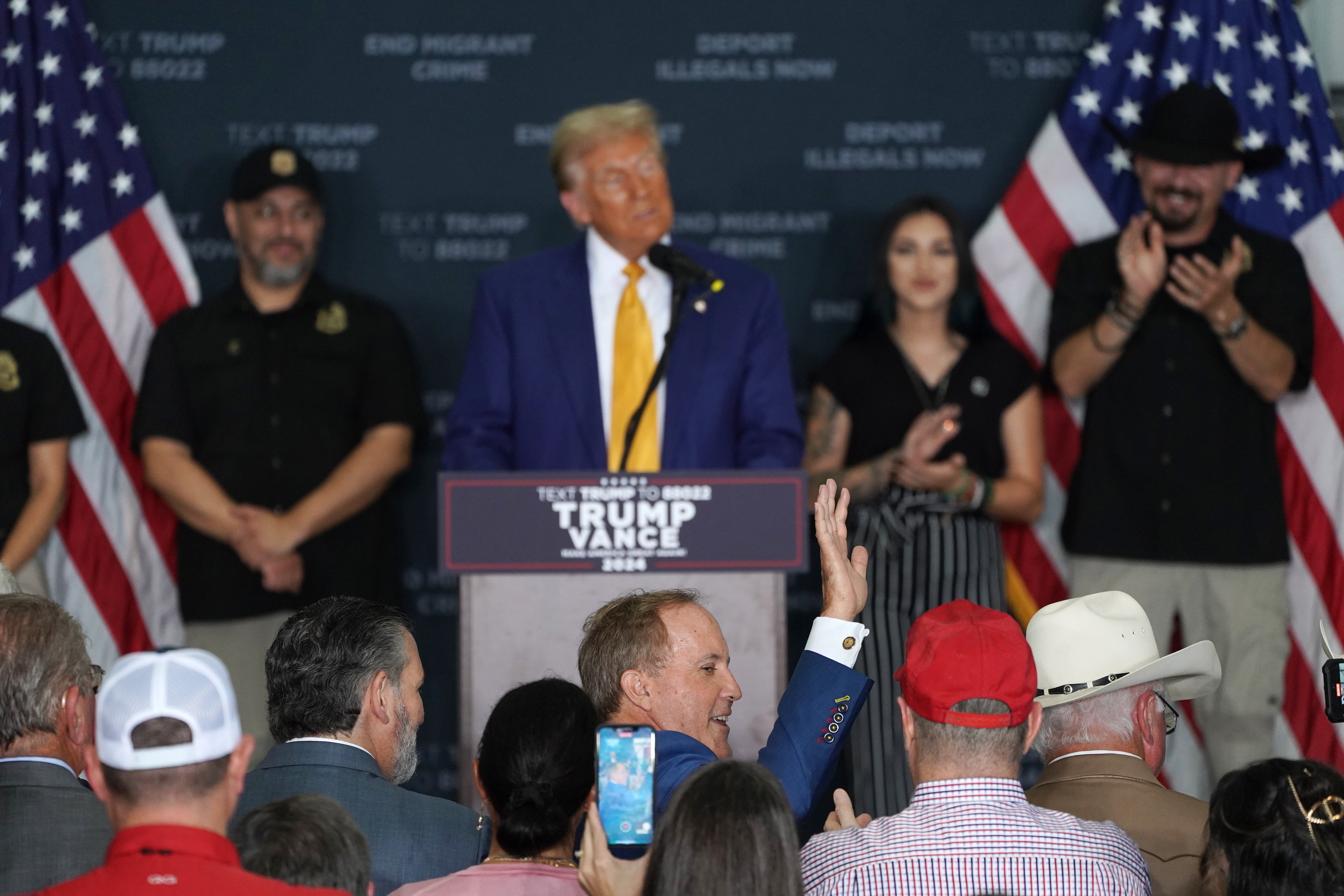 Texas Attorney General Ken Paxton, floated among Trump’s circle for next US attorney general, waves as Trump introduces him during a campaign rally