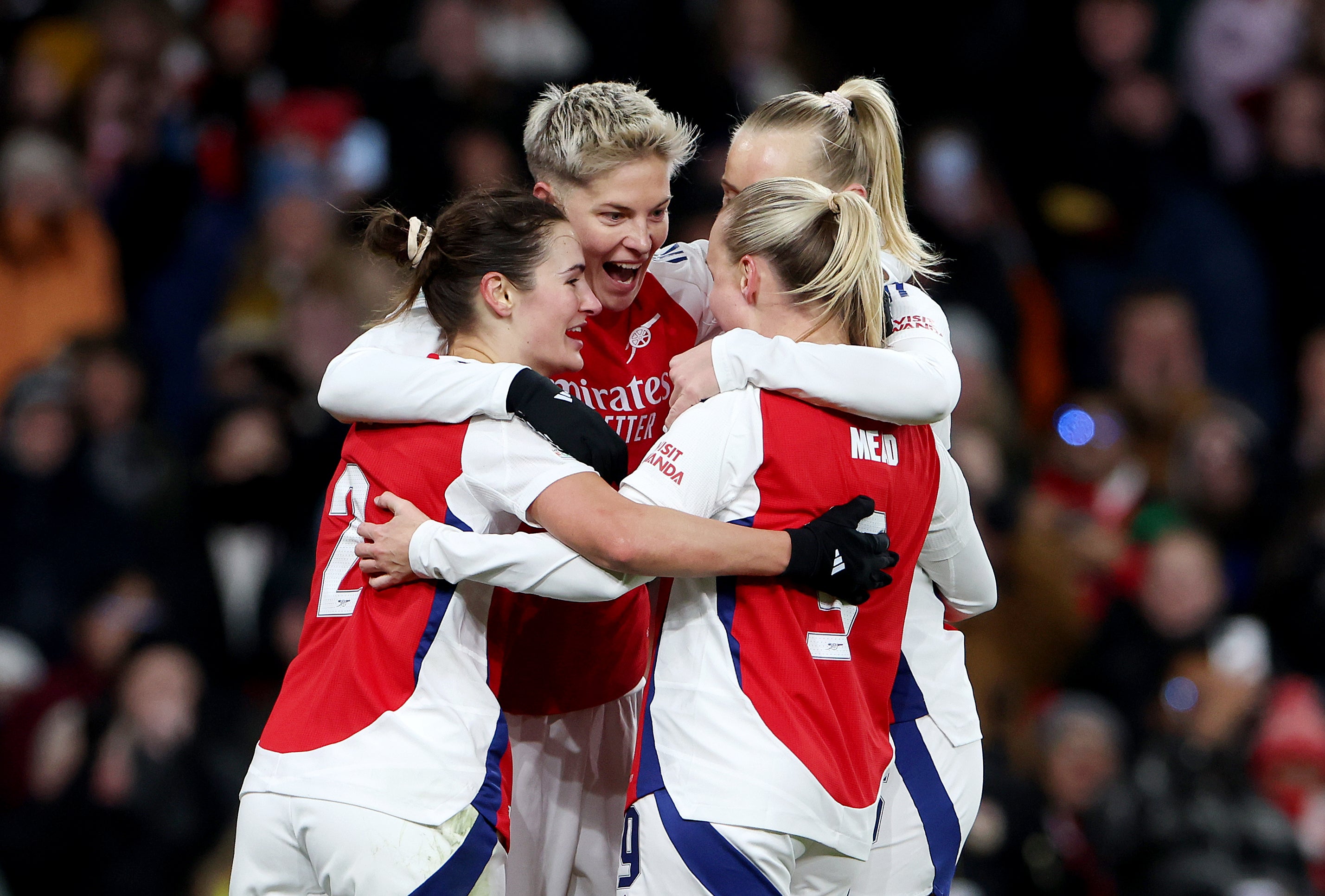 Arsenal players surround Lina Hurtig (centre) after she scored the decisive goal