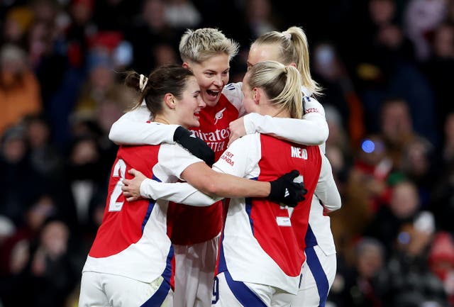 <p>Arsenal players surround Lina Hurtig (centre) after she scored the decisive goal </p>