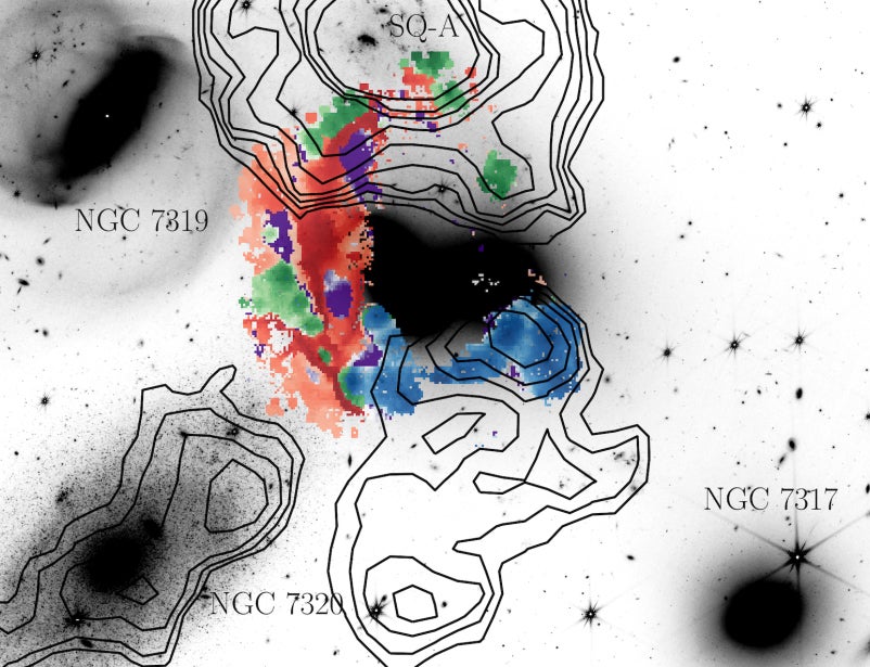 The red highlights gas shocked by the collision, while green and blue shows star-forming regions (M. Arnaudova/University of Hertfordshire/WEAVE consortium)